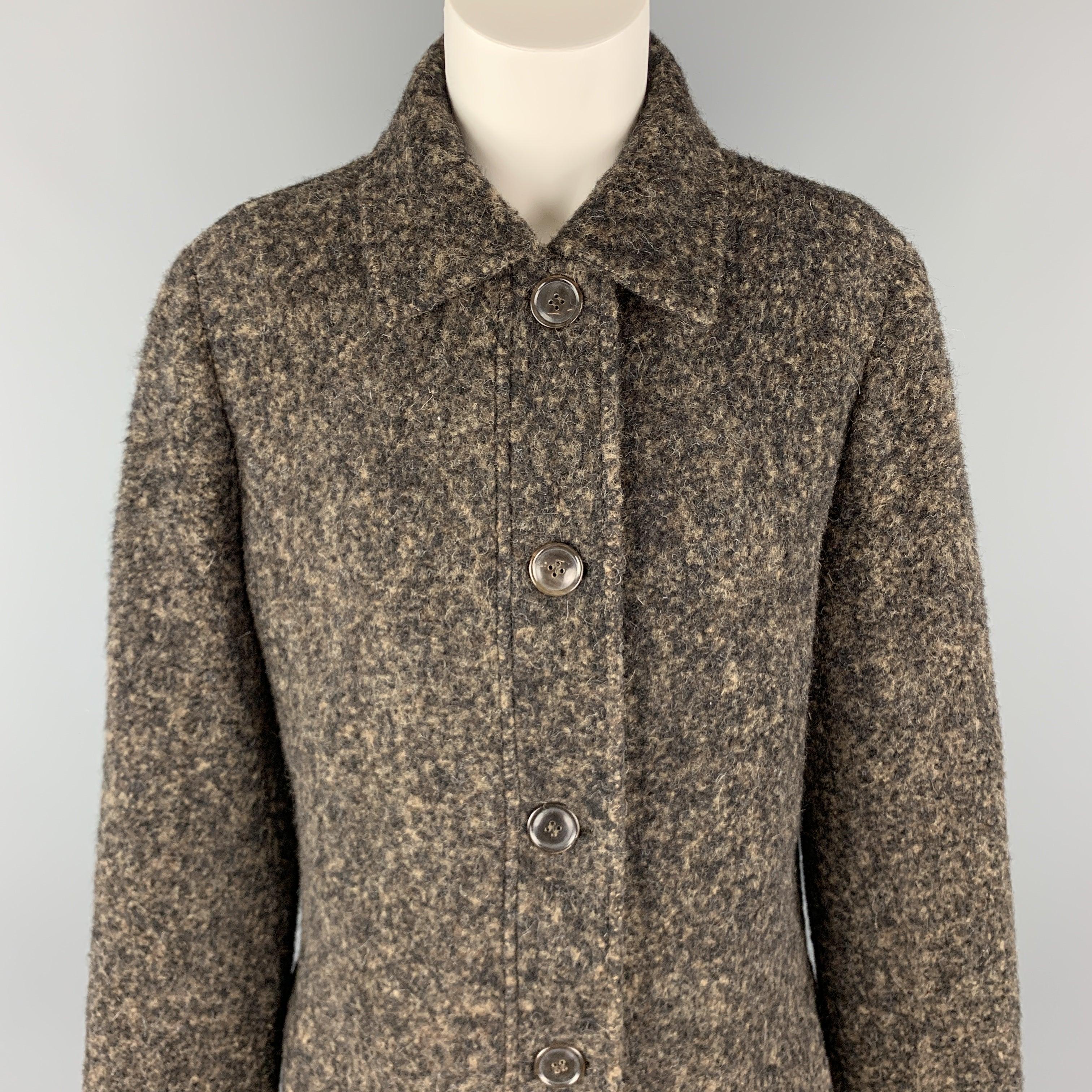 LUCIANO BARBERA coat comes in black and taupe marbled alpaca fabric with a pointed collar, flap pockets, and single breasted button front. Made in Italy.Excellent Pre-Owned Condition. 

Marked:   IT 44 

Measurements: 
 
Shoulder:
16 inches Bust:
42