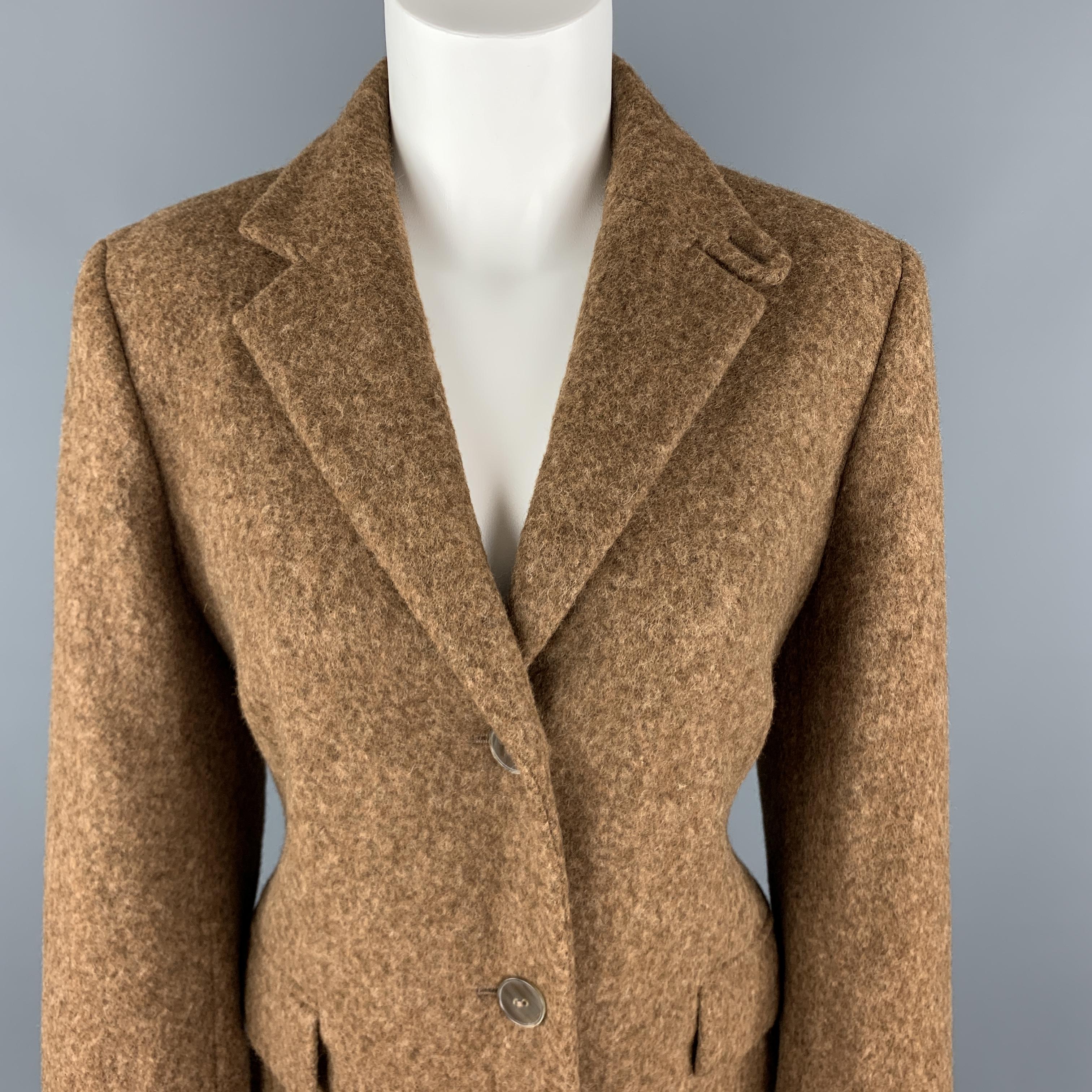 LUCIANO BARBERA coat comes in heathered tan alpaca blend fabric with a tab collar notch lapel, flap pockets, and single breasted button front. Made in Italy.

Excellent Pre-Owned Condition.
Marked: IT 44

Measurements:

Shoulder: 16 in.
Bust: 40