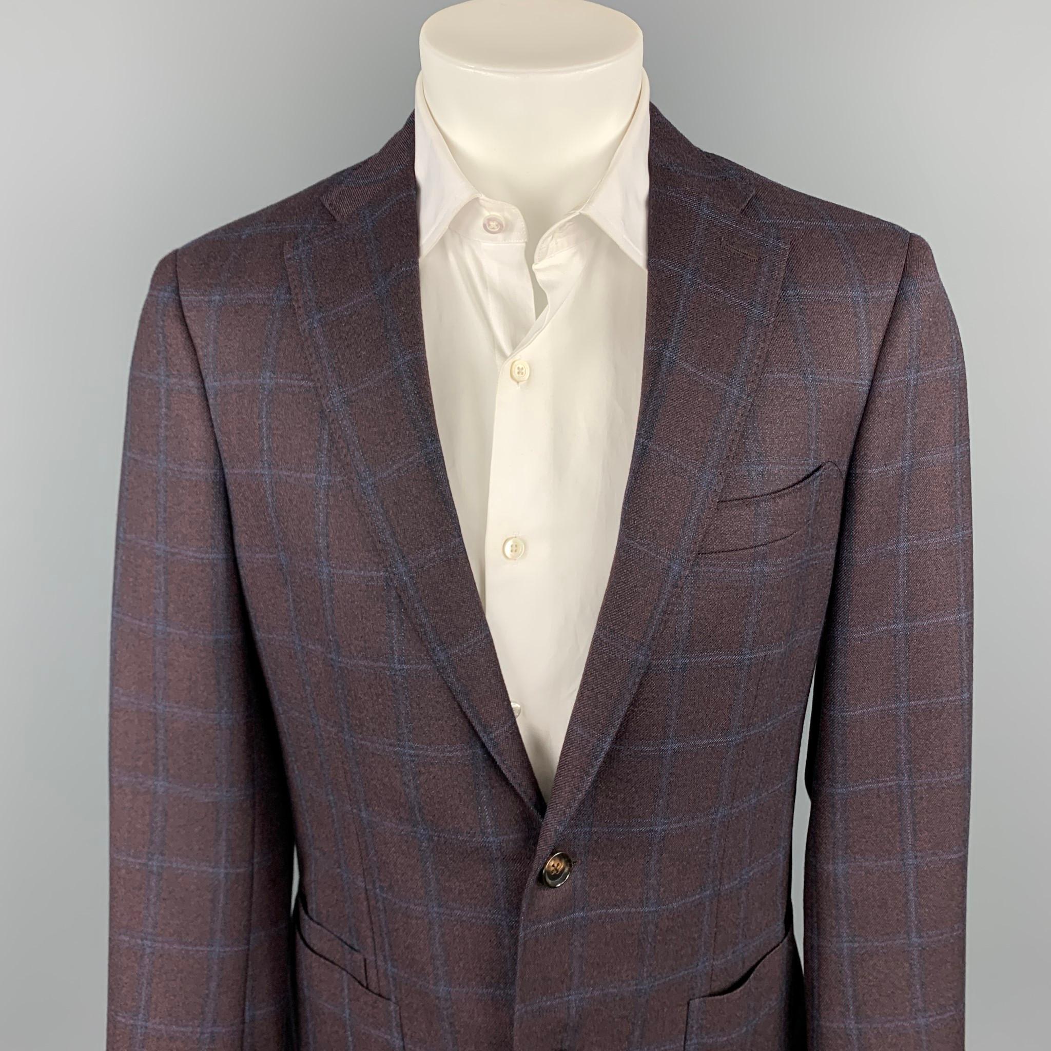 LUCIANO BARBERA custom sport coat comes in a brown & navy window pane wool with a half liner featuring a notch lapel, patch pockets, and a two button closure. Made in Italy.

Very Good Pre-Owned Condition.
Marked: IT 50

Measurements:

Shoulder: 18