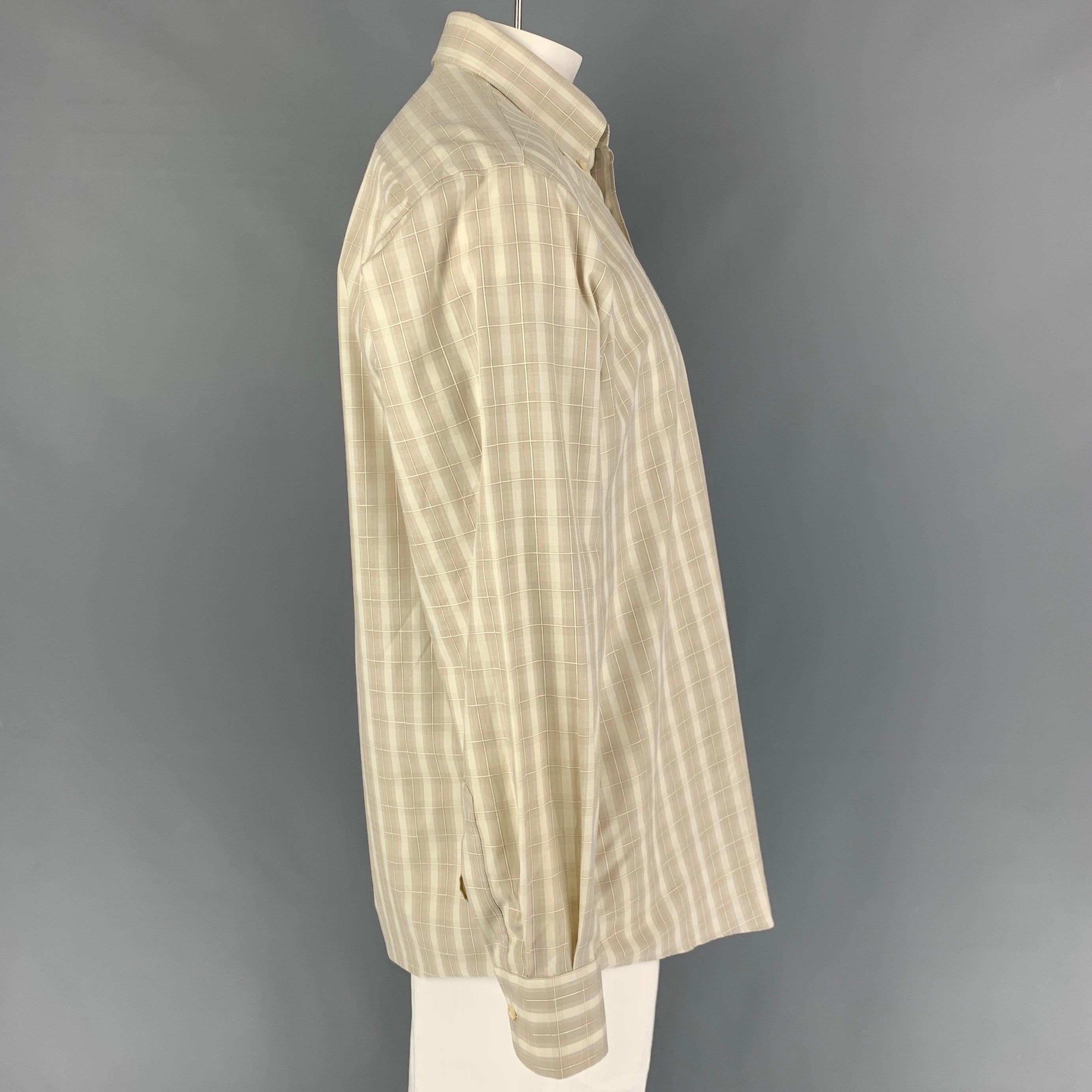 LUCIANO BARBERA long sleeve shirt comes in a beige window pane featuring a button down collar, patch pocket, and a button up closure. Made in Italy.
Very Good
Pre-Owned Condition.  

Marked:   L  

Measurements: 
 
Shoulder: 19.5 inches  Chest: 48