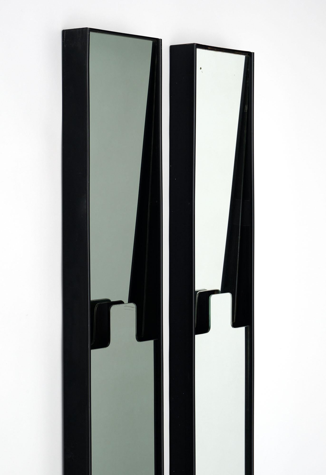 Set of six “Gronda” mirrors/coat racks by Luciano Bertoncini for Elco. The upper part of each module can be pushed back to become a coat hanger. Three have a smoked glass finish. They can be mixed and matched together in different ways.