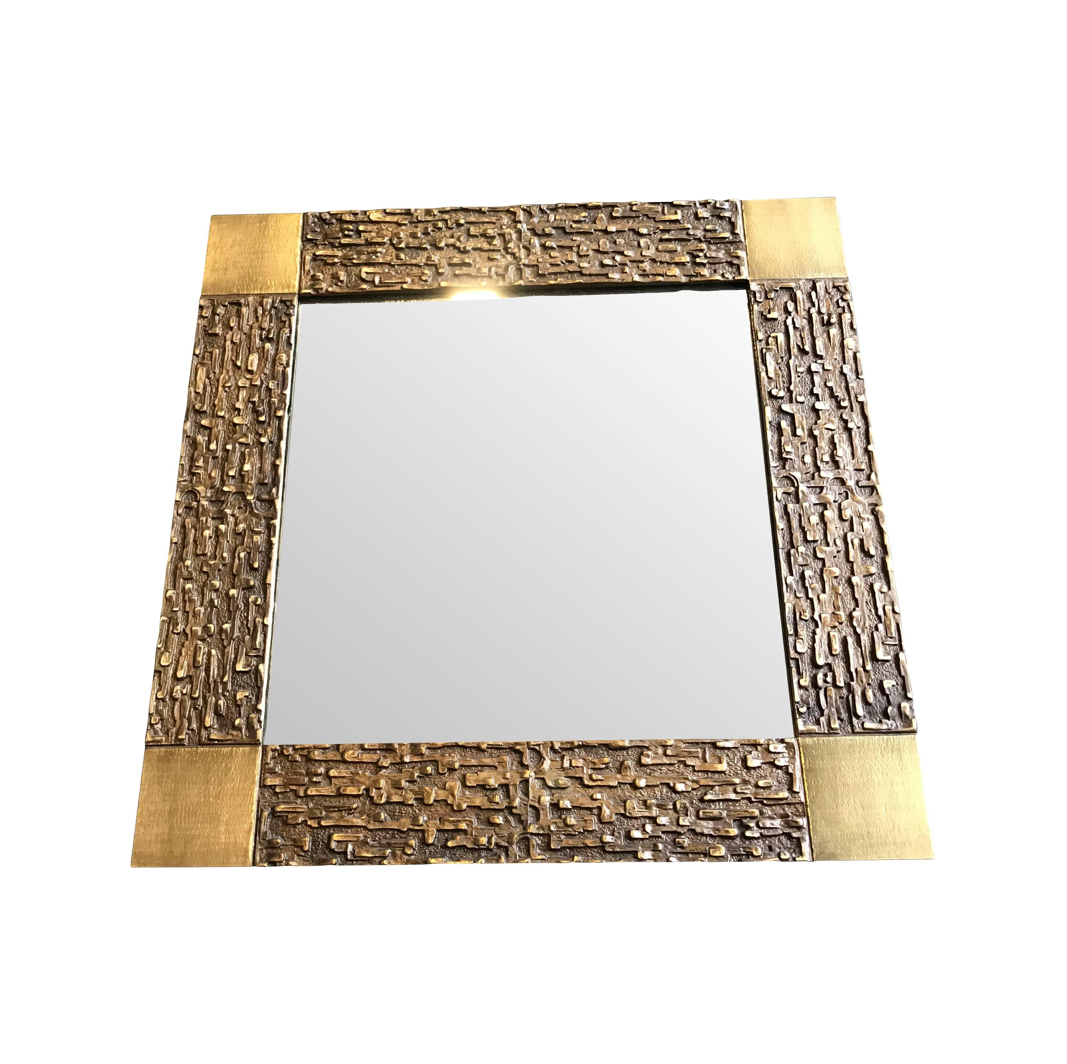 A Luciano Frigerio mirror with sculptural Brutalist solid bronze frame.