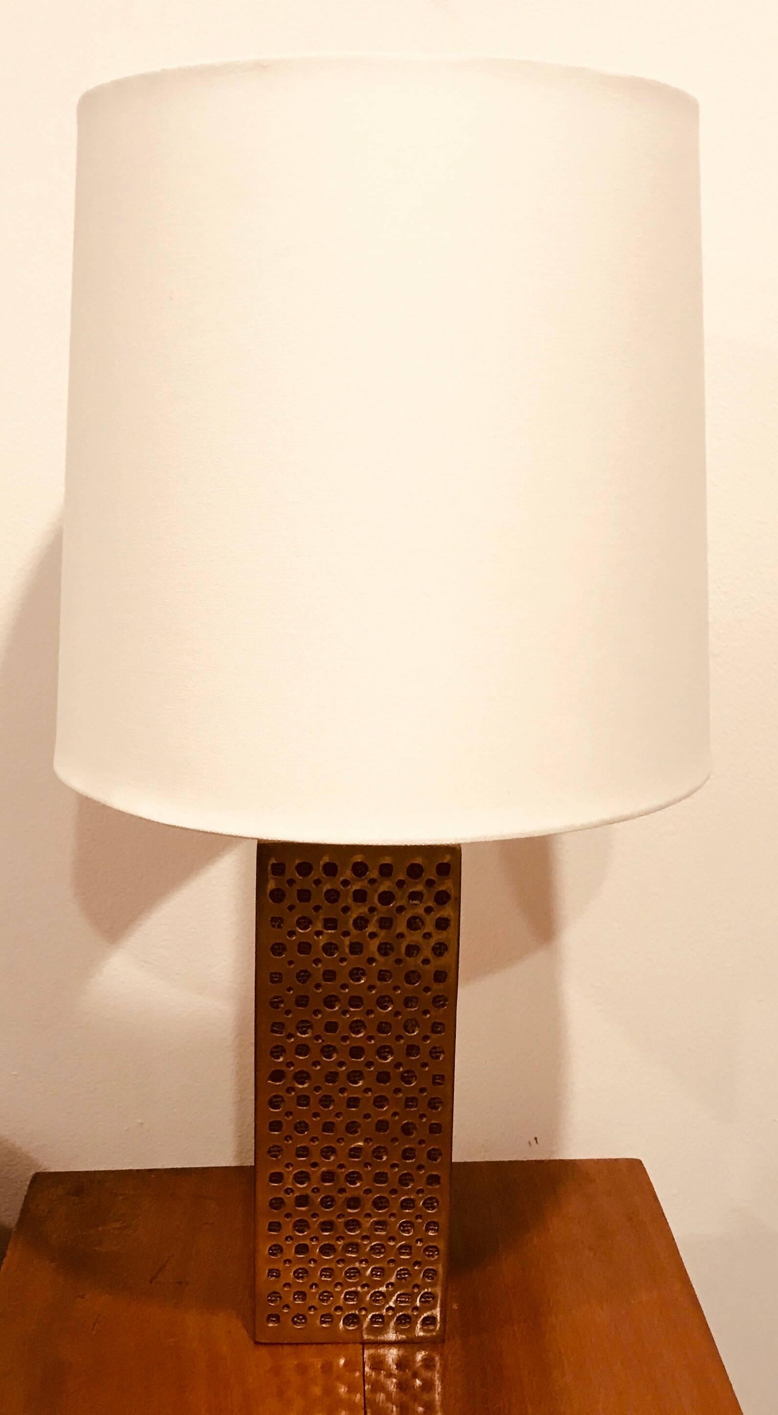 A handcrafted Italian bronze column table lamp with an inset geometric pattern designed by Italian designer, Luciano Frigerio. Newly rewired column height is 11.5”.