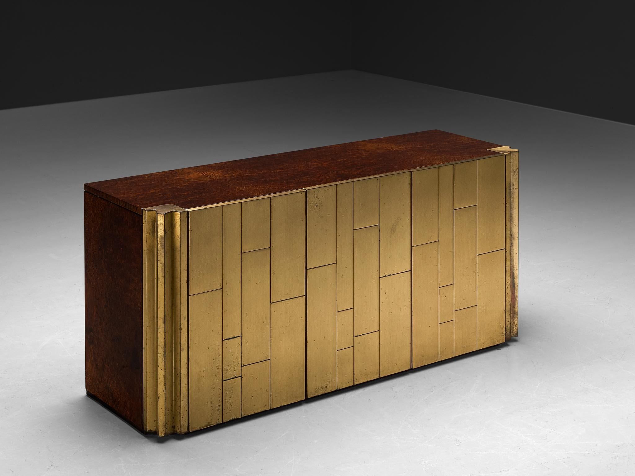 Luciano Frigerio for Frigerio di Desio, sideboard, brass, walnut wood, Italy, 1970s

This exquisite sideboard, masterfully crafted by the imaginative Italian designer Luciano Frigerio, beautifully captures the aesthetic nuances of the 1970s era. The