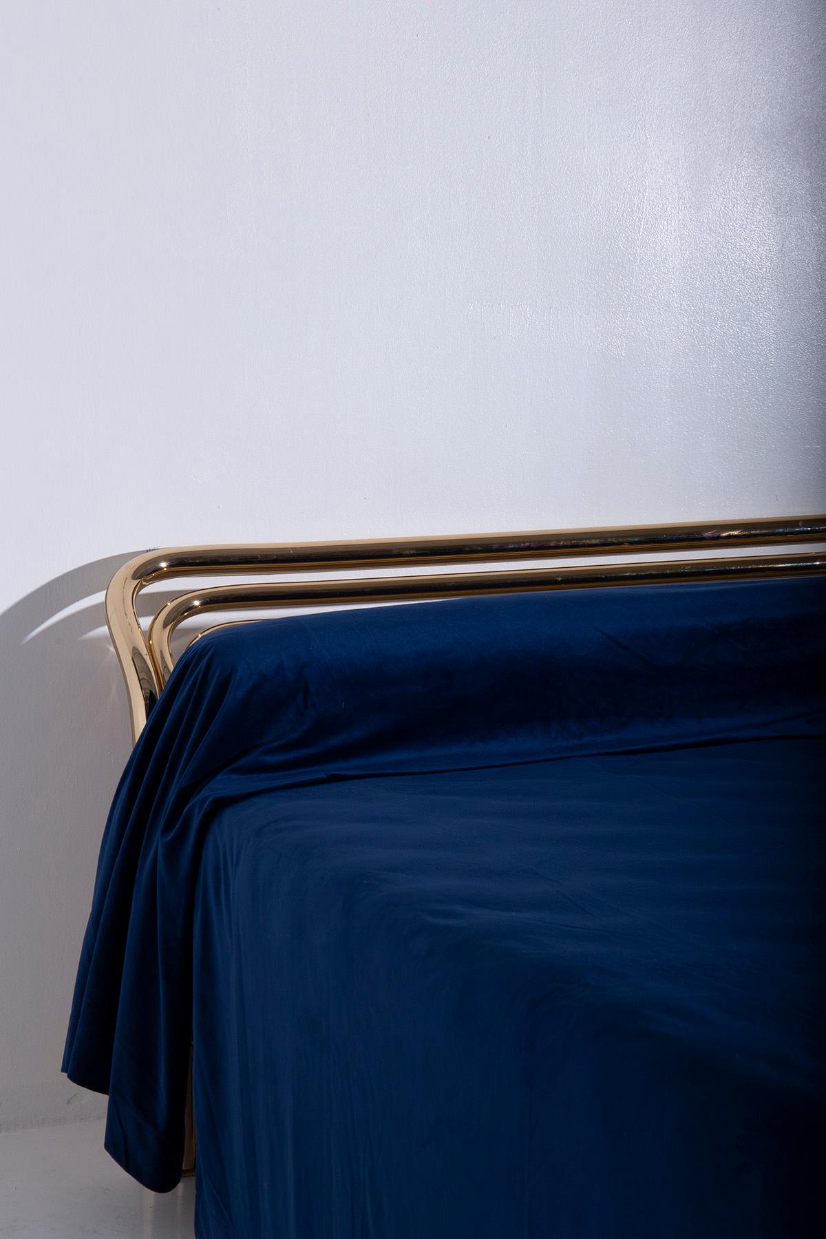 Step back in time to the glamorous 1970s with this exquisite Italian double bed designed by the talented Lucino Frigerio and proudly marked by the same illustrious manufacturer. Its very essence is crafted from lustrous brass tubing, a material