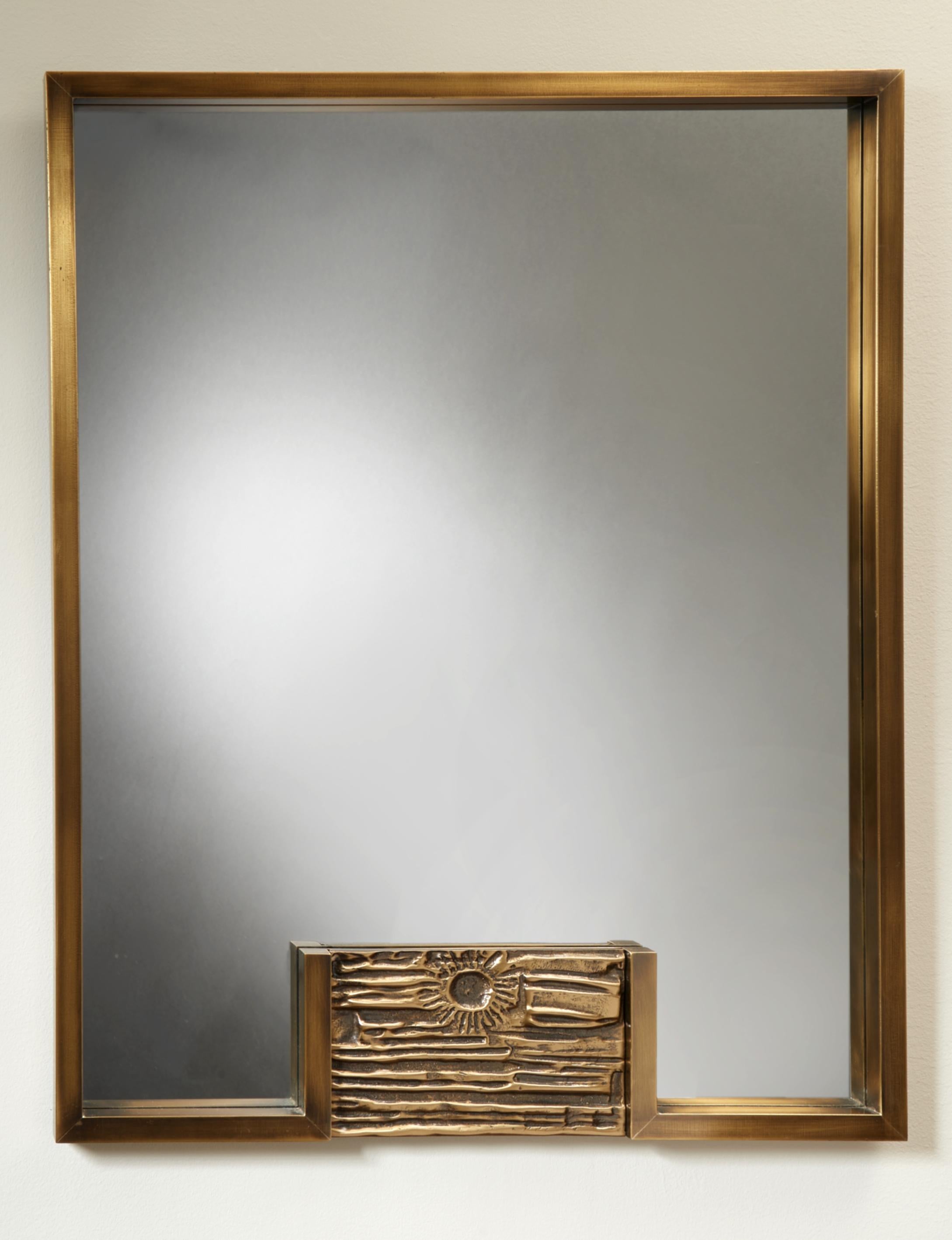Luciano Friegerio (1928-1999)

A mirror in sculpted bronze by designer and artist Luciano Frigerio. A beautifully cast bas-relief depicting an abstracted sunrise grounds the rectangular frame. The piece represents a strong application of Frigerio's