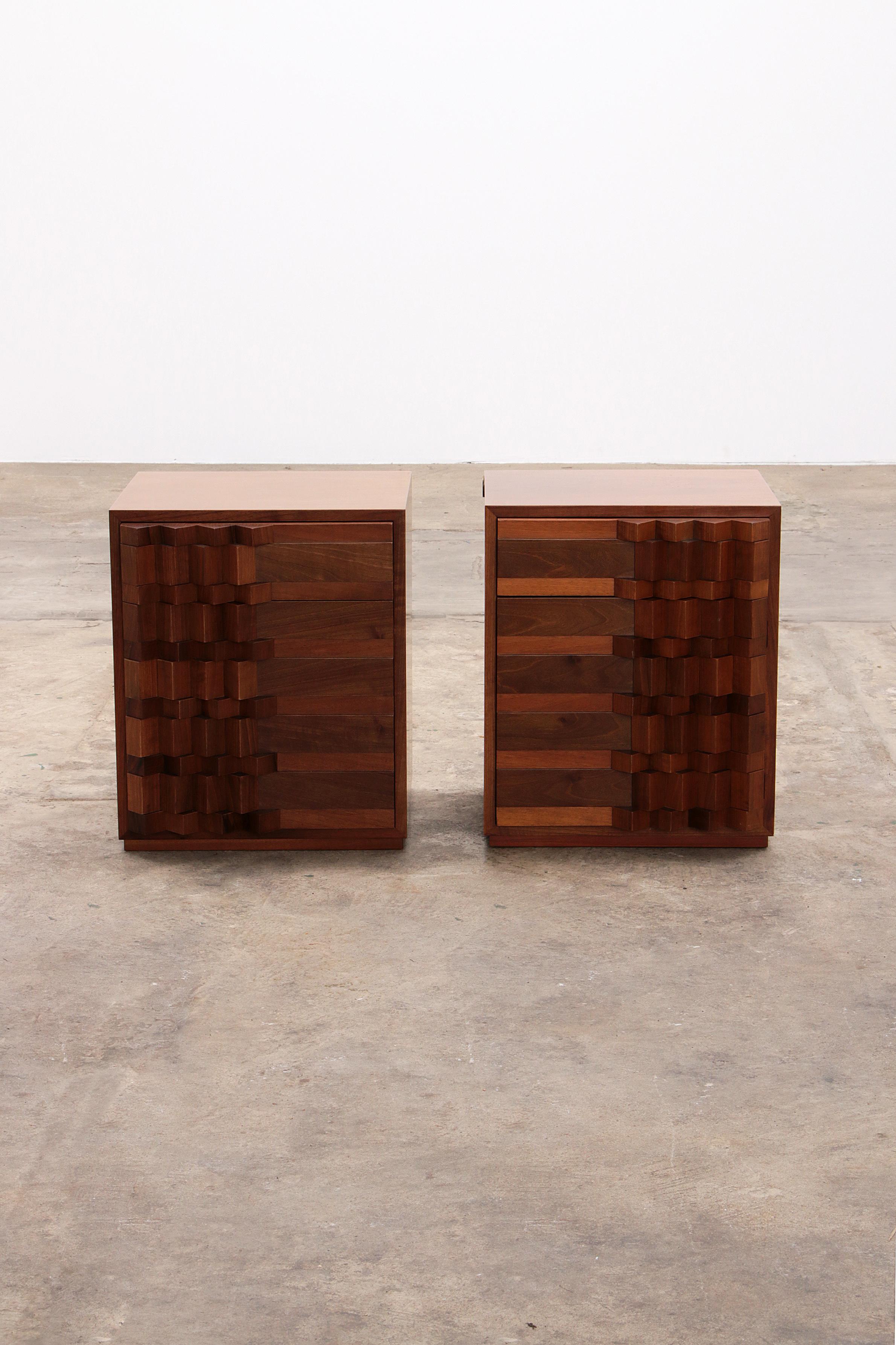 uciano Frigerio  bedside tables  1970

Beautiful pair of bedside tables with graphic doors designed and manufactured by Luciano Frigerio, Italy 1970. These bedside tables are made of brown glossy lacquered wood. The graphic doors are composed of