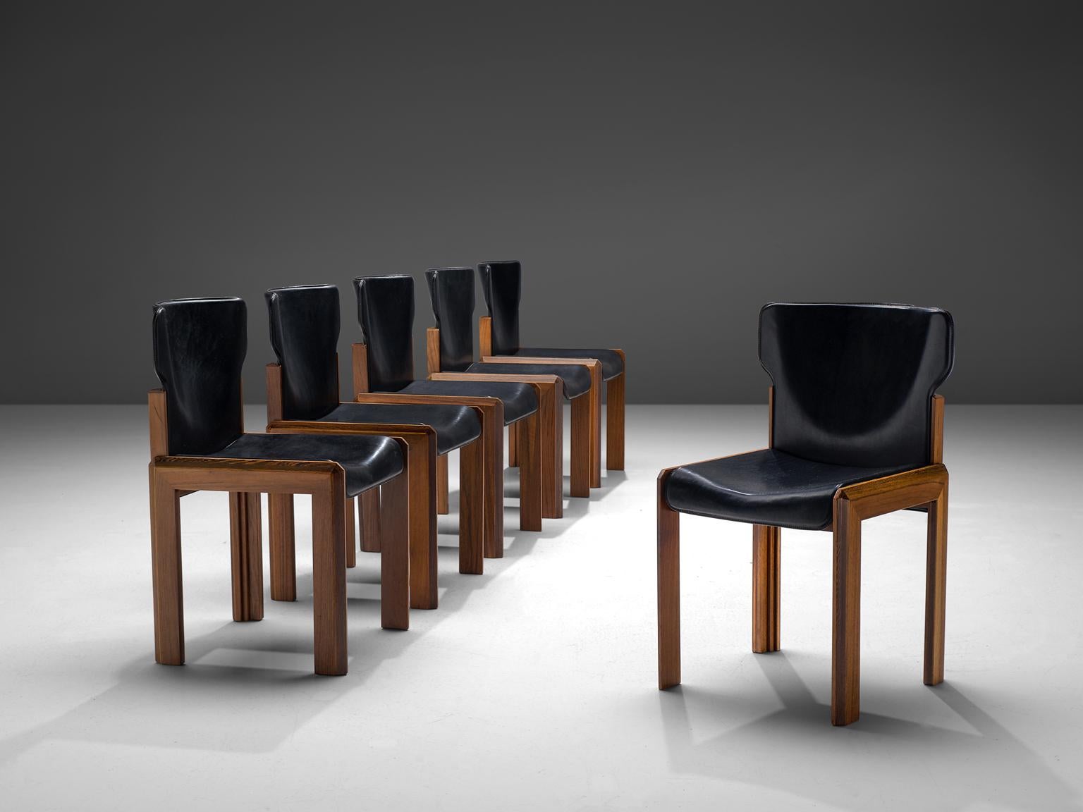 Luciano Frigerio, set of six leather 'Pagani' chairs in various woods, Italy, circa 1975

These chairs are built up of a frame with laminated, marqueterie of noble woods. The chairs have a dent seat and bac. These stylistic choices result in a