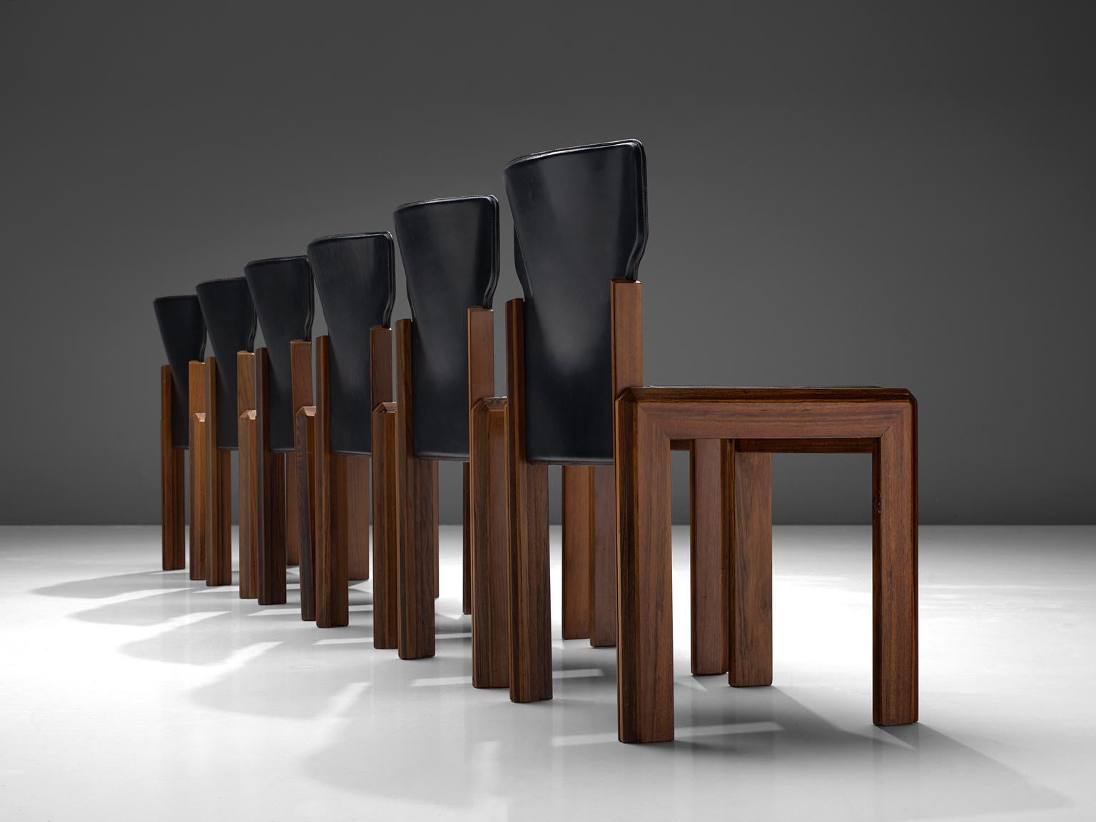 Luciano Frigerio, set of six leather 'Pagani' chairs in various woods, Italy, circa 1975

These chairs are built up of a frame with laminated, marqueterie of noble woods. The chairs have a dent seat and bac. These stylistic choices result in a more