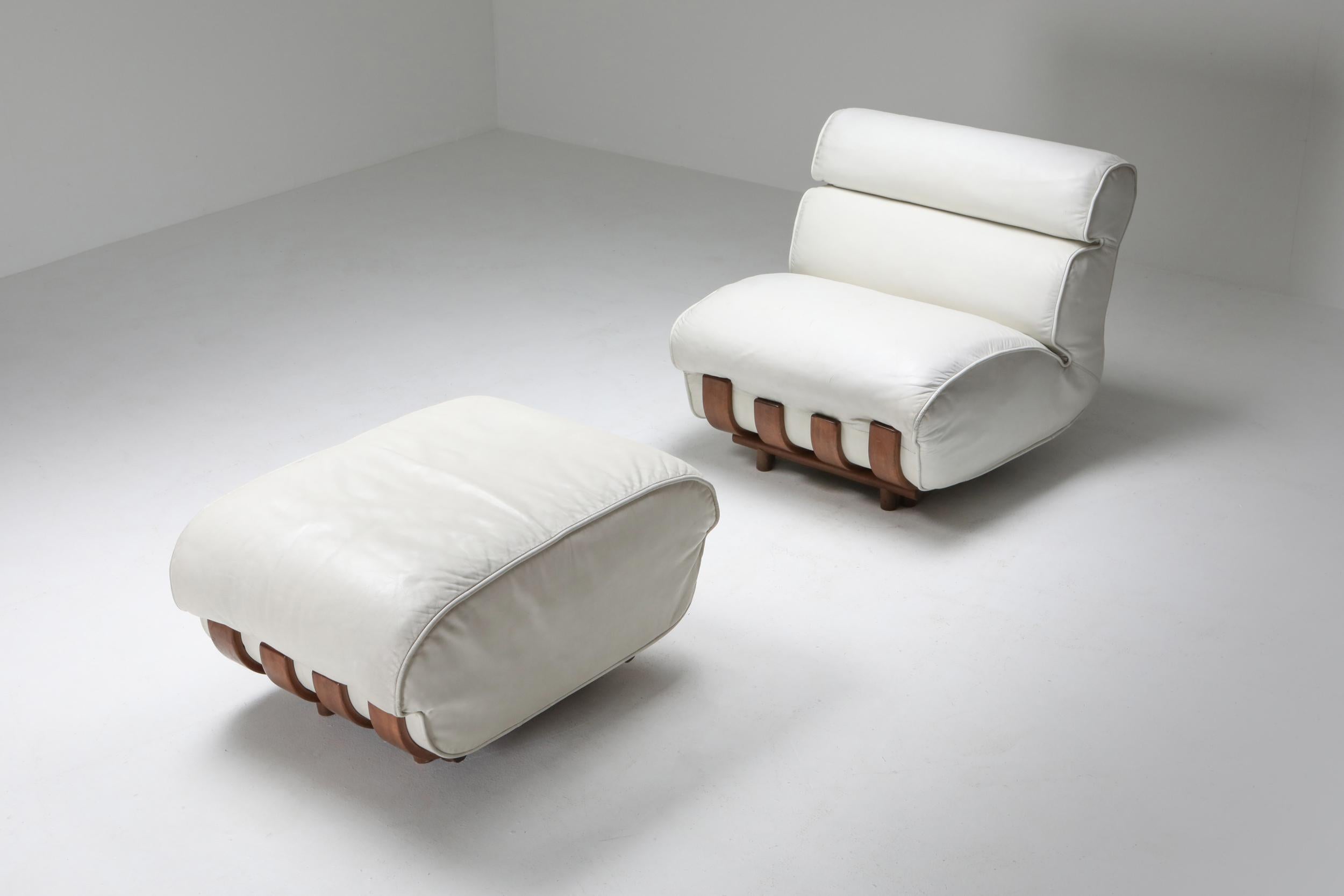 Walnut and white leather lounge chair, Postmodern Italy, by Luciano Frigerio.

Luxury leather design which is extremely comfortable.
A good alternative for a Soriana of camaleonda lounge chair.
  