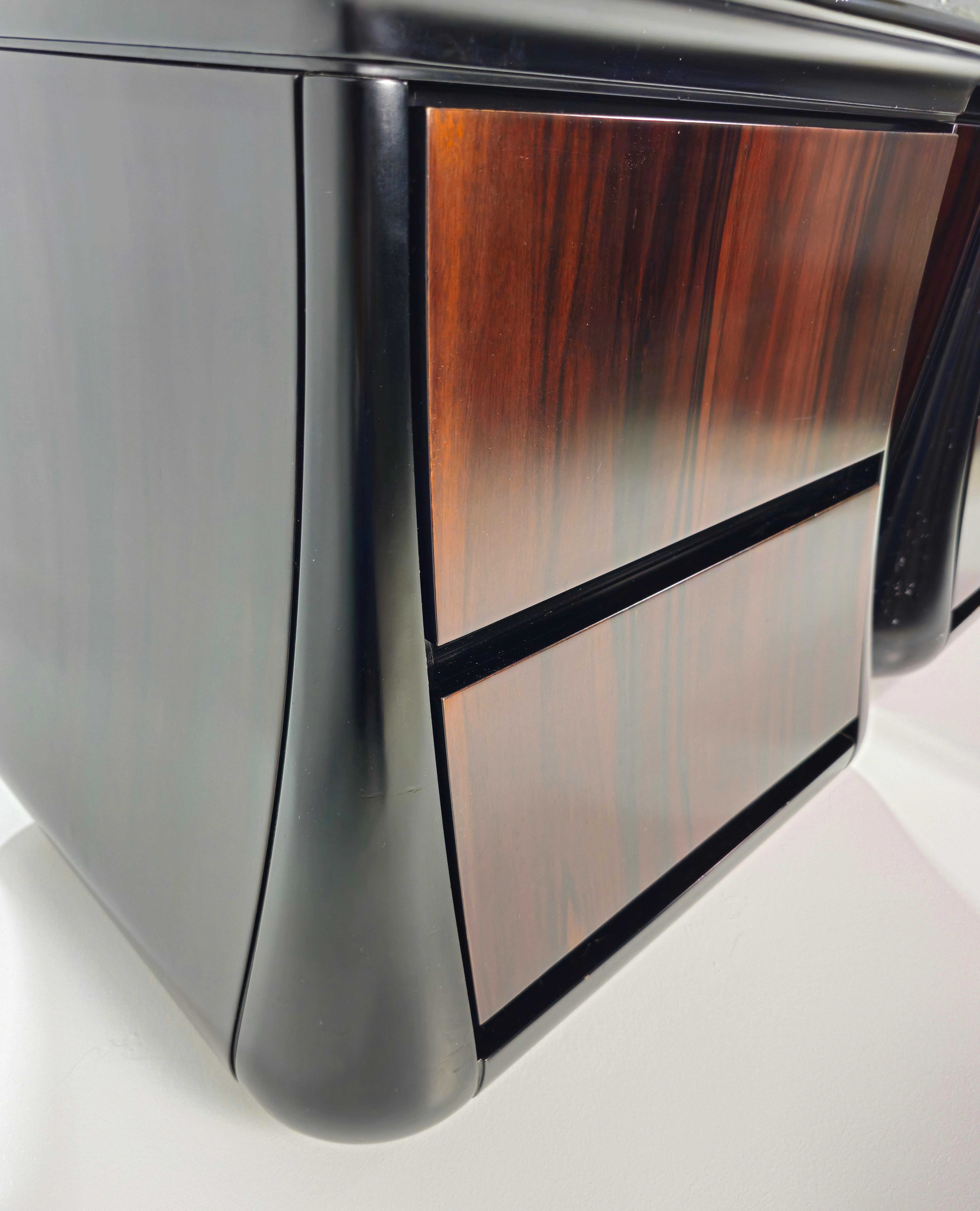 Rare and valuable pair of Macassar ebony bedside tables by Luciano Frigerio of Desio. Made of ebony with a black front frame with 2 drawers. A very resistant and valuable wood. Sought after for its sturdiness, perfect for furnishing. A valuable