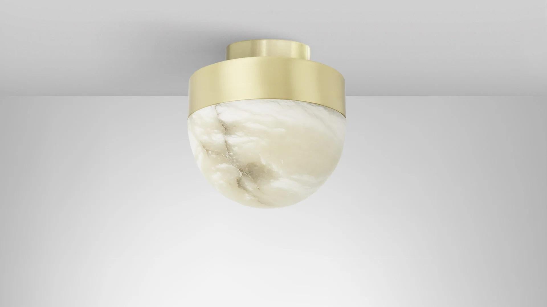 Lucid 200 flush lamp by CTO Lighting
Materials: honed alabaster with satin brass base.
Also available in honed alabaster with bronze base.
Dimensions: H 20 x W 20 cm

All our lamps can be wired according to each country. If sold to the USA it will