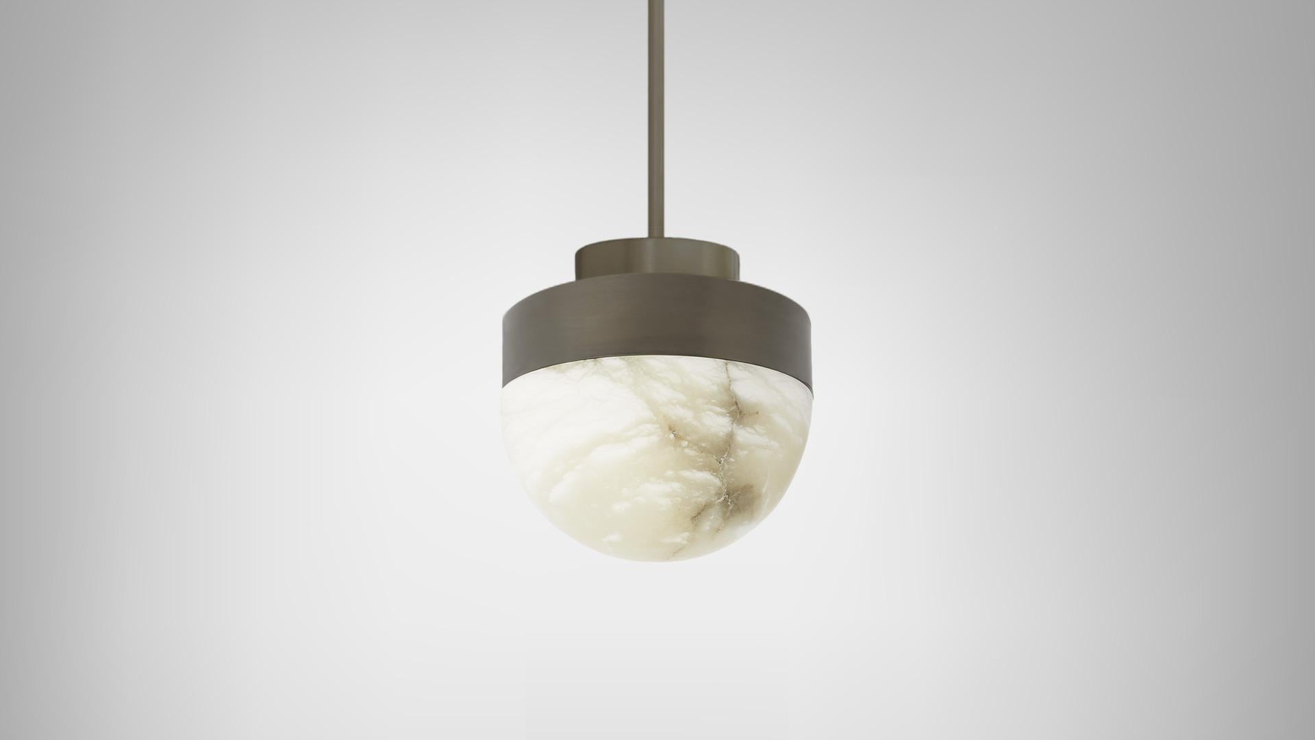 Lucid 200 pendant by CTO Lighting
Materials: honed alabaster with satin brass base.
Also available in honed alabaster with bronze base.
Dimensions: H 25 x W 20 cm

All our lamps can be wired according to each country. If sold to the USA it will