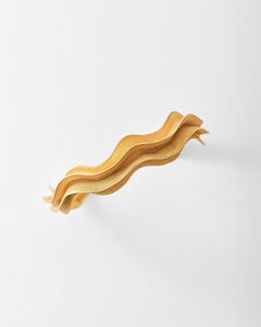 Pulsera «Lucid Cuff» con diseño ondulado en vermeil dorado de Aur Studio