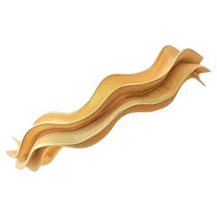 Pulsera «Lucid Cuff» con diseño ondulado en vermeil dorado de Aur Studio