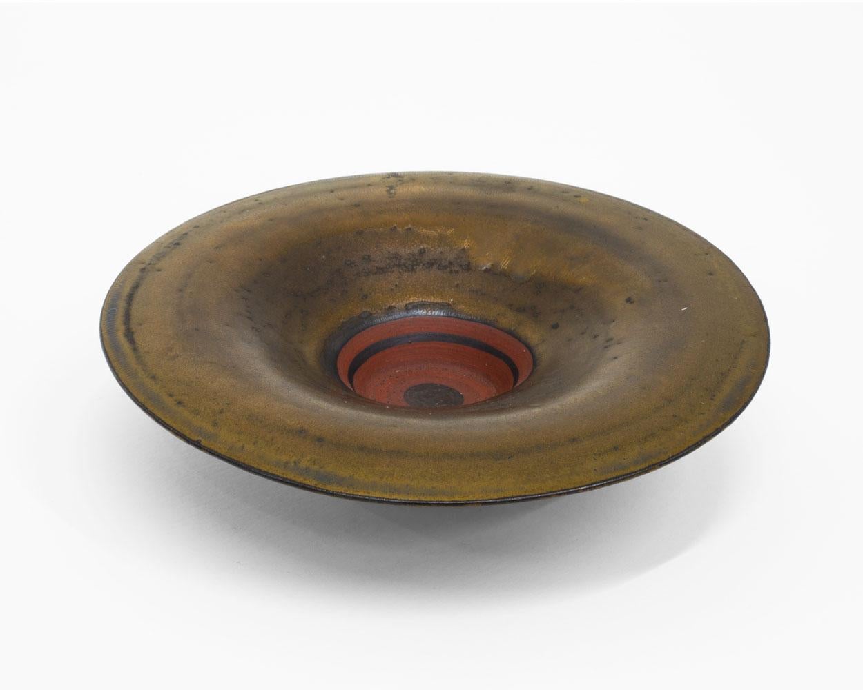 Impressed with artist's seal
porcelain with a golden bronze glaze and terracotta-red well
2 x 8 inches 