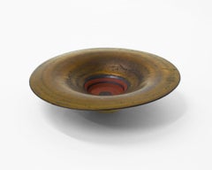 Ciotola dorata con pozzo in terracotta