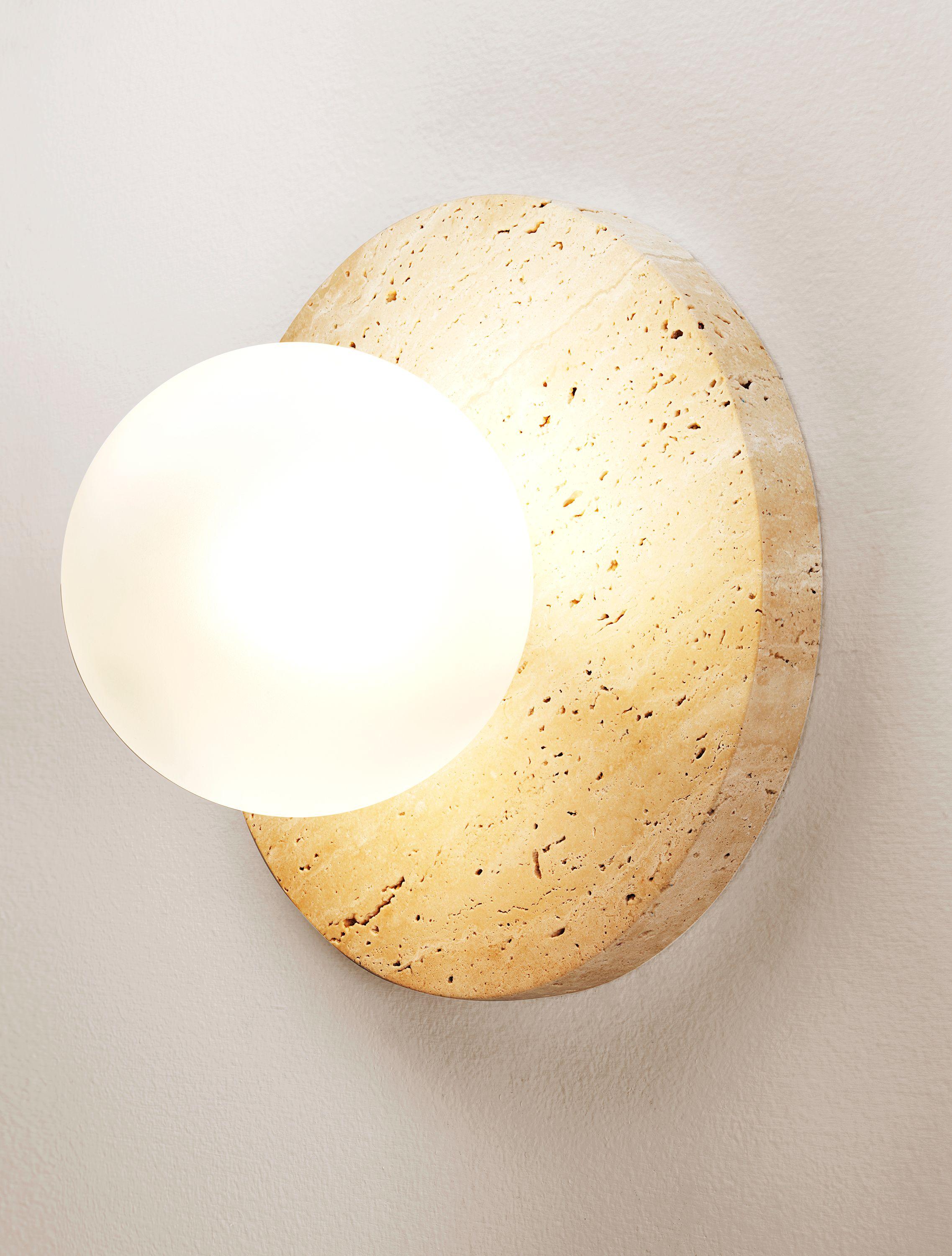 LUCIE FLUSHMOUNT
Introducing the Lucie Flushmount in Travertine and glass; a daring tribute to timeless design inspired by the graceful proportions of Dior's iconic pearl earrings. Lucie's circular stone backplate serves as an exquisite canvas for