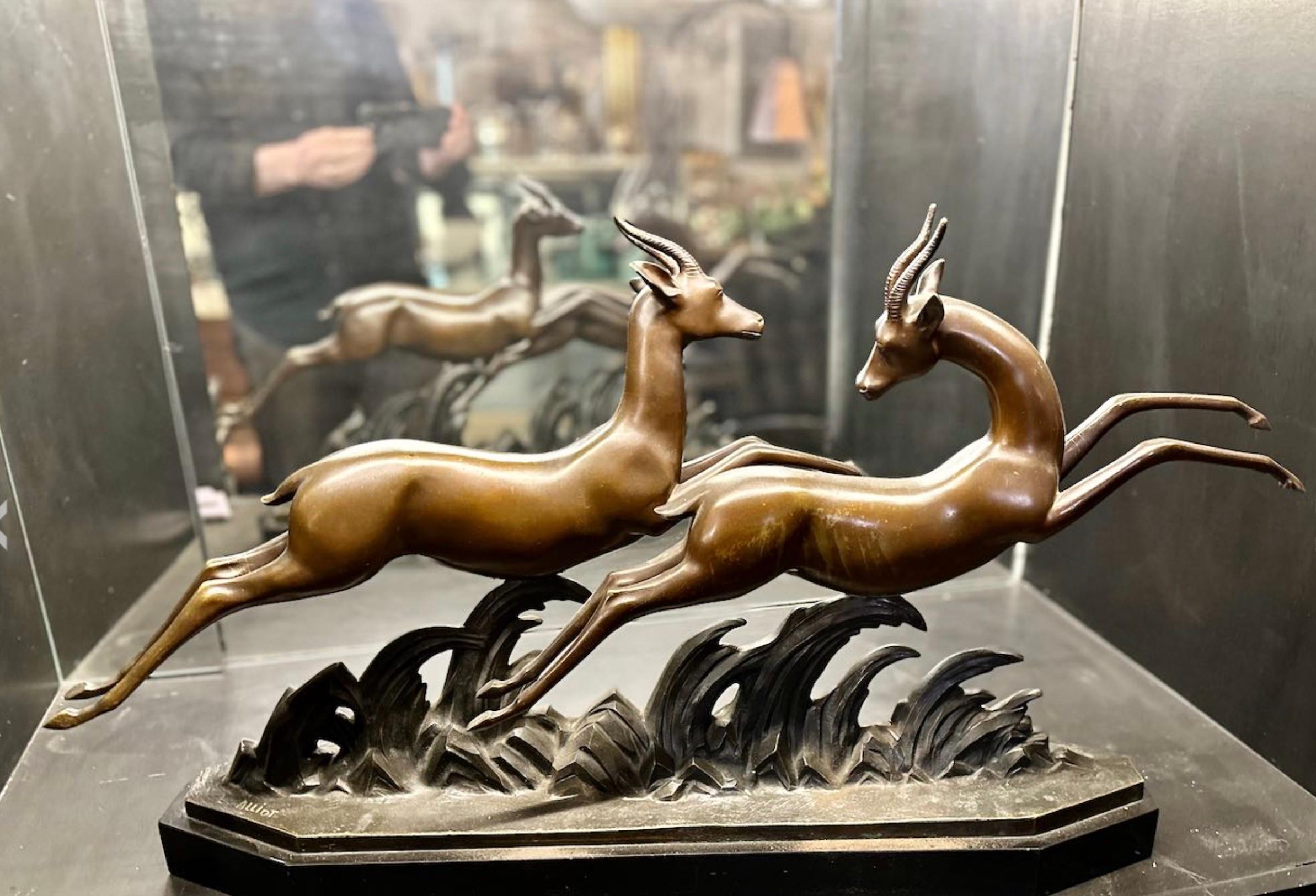 Lucien Alliot French Art Deco Bronze The Gazelles 1930. The brown patina on a marble base signed on the bronze L Alliot and stamped bronze on the deer. This particular piece has exceptional rhythm where the two gazelles interplay in a movement