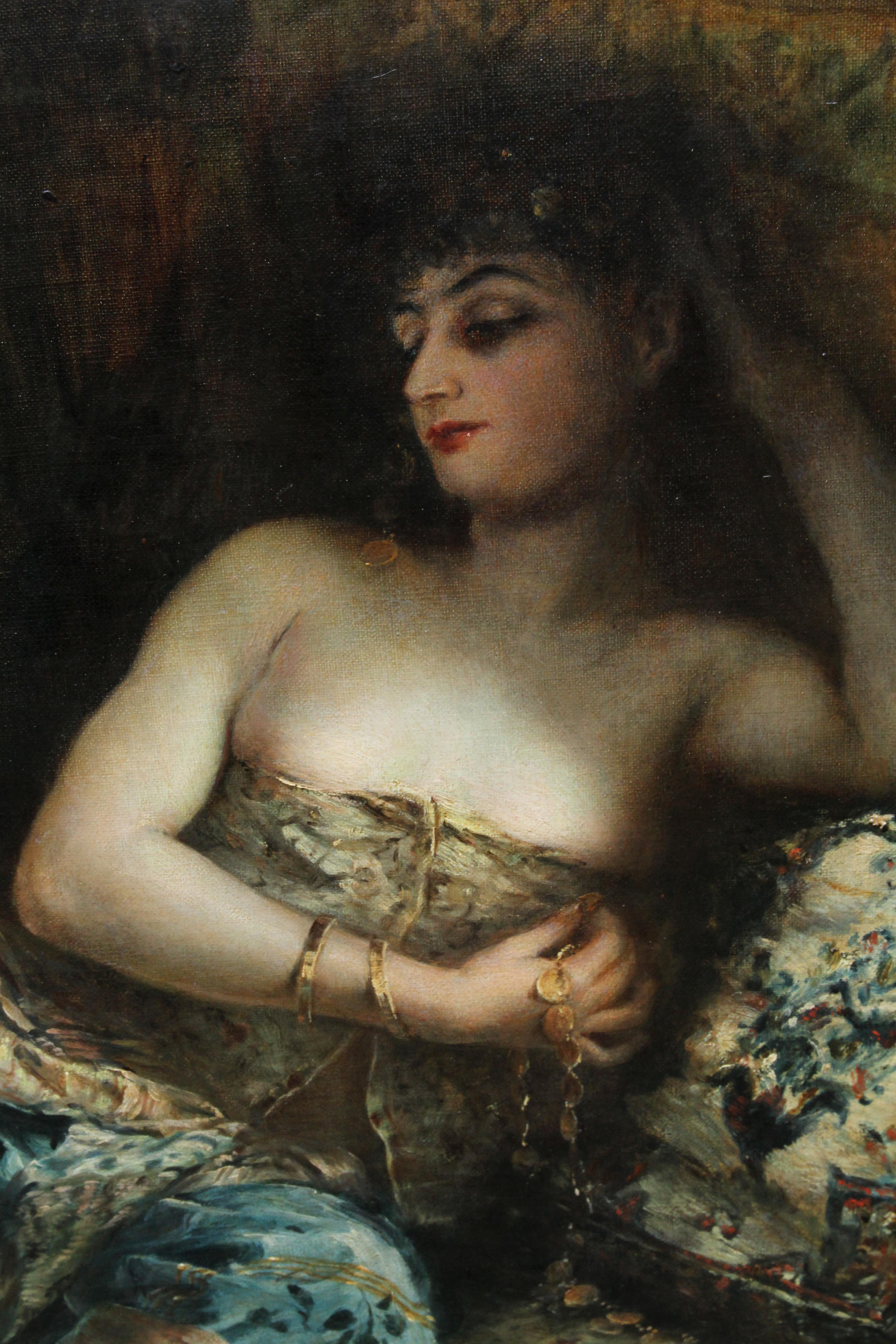 Cette charmante peinture à l'huile orientaliste victorienne, ancienne de Christie's, est l'œuvre de Lucien Laurent Gsell, artiste français exposé de renom. Le tableau date d'environ 1900 et représente une belle jeune femme allongée sur un canapé. Le