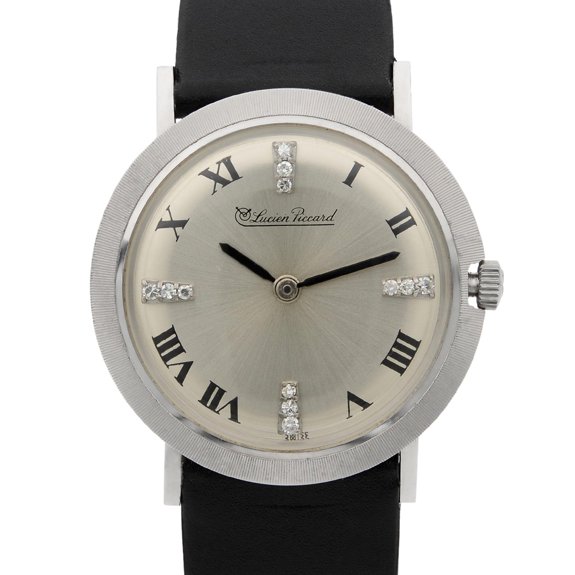 This pre-owned Lucien Piccard N/A N/A is a beautiful Ladie's timepiece that is powered by mechanical (hand-winding) movement which is cased in a white gold case. It has a round shape face, no features dial and has hand roman numerals style markers.