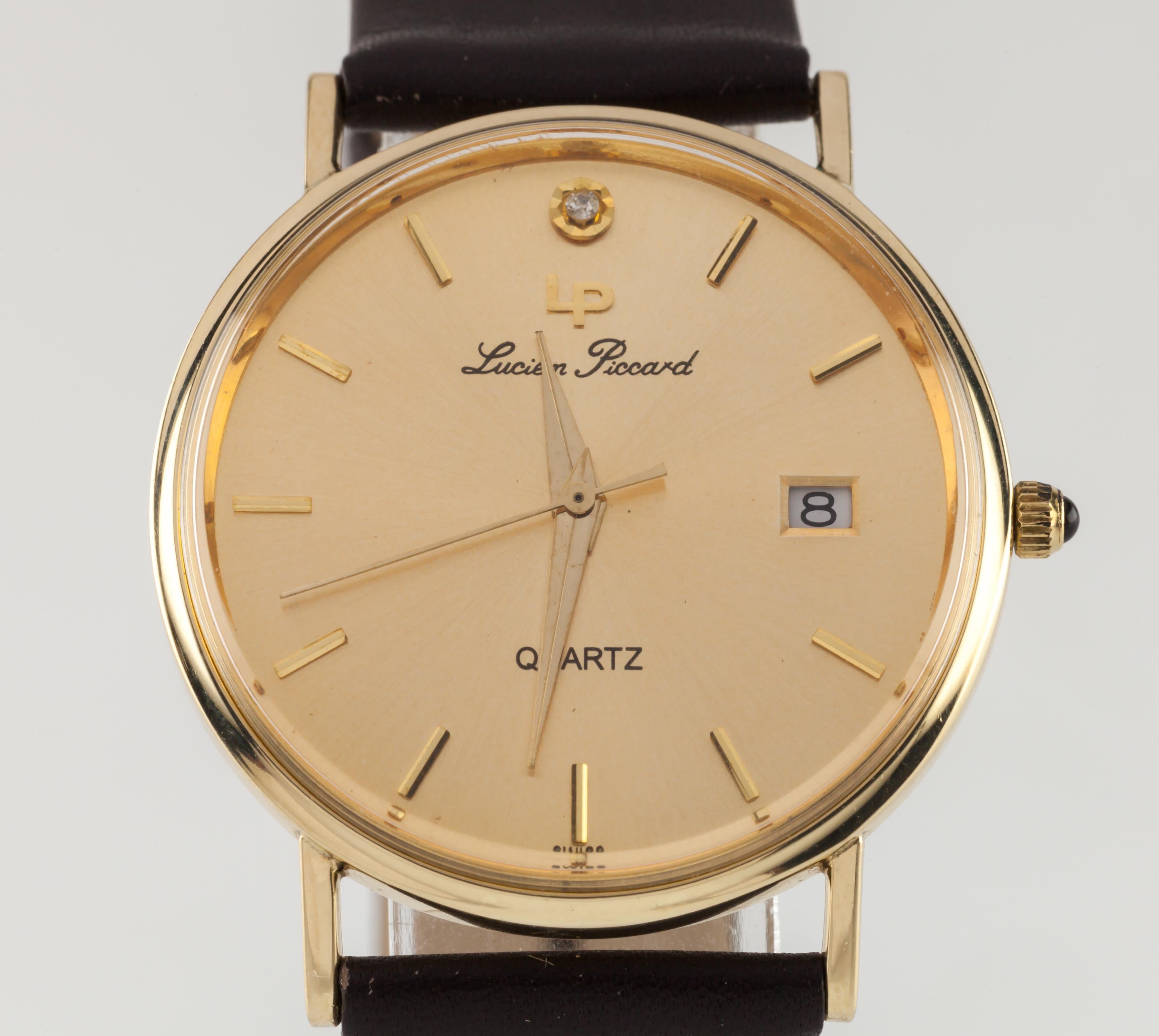 Lucien Piccard 14k Yellow Gold Quartz Watch w/ Date and Leather Band 24787

Movement #705
Case #24787

14k Yellow Gold Round Case
33 mm in Diameter (36 mm w/ Crown)
Lug-to-Lug Distance = 39 mm
Lug-to-Lug Width = 19 mm
Thickness = 7 mm

Gold Lucien