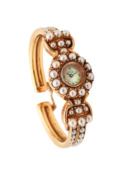 LUCIEN PICCARD 1970 Manschettenarmbanduhr aus 14 Karat Gelbgold mit weißenen Perlen