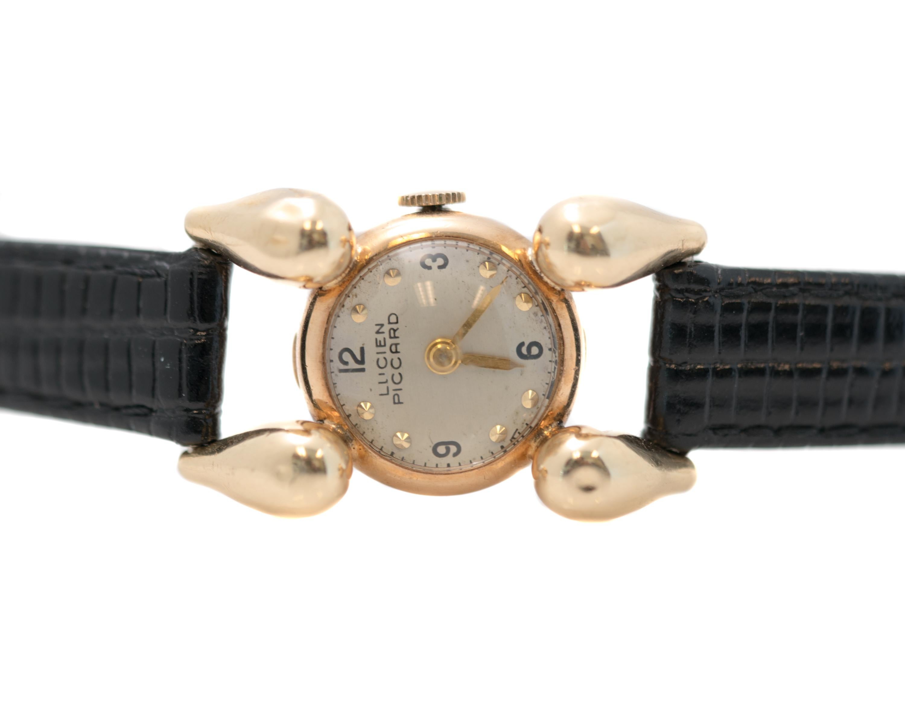 1940s Retro Art Deco- Inspired Lucien Piccard Wrist Watch - 14 Karat Yellow Gold

Features: 
Case Diameter: 19 millimeters without crown
Case Length: 34 millimeters lug to lug, top to bottom
14 Karat Yellow Gold Case, Lugs, Hour Markers, Hour and