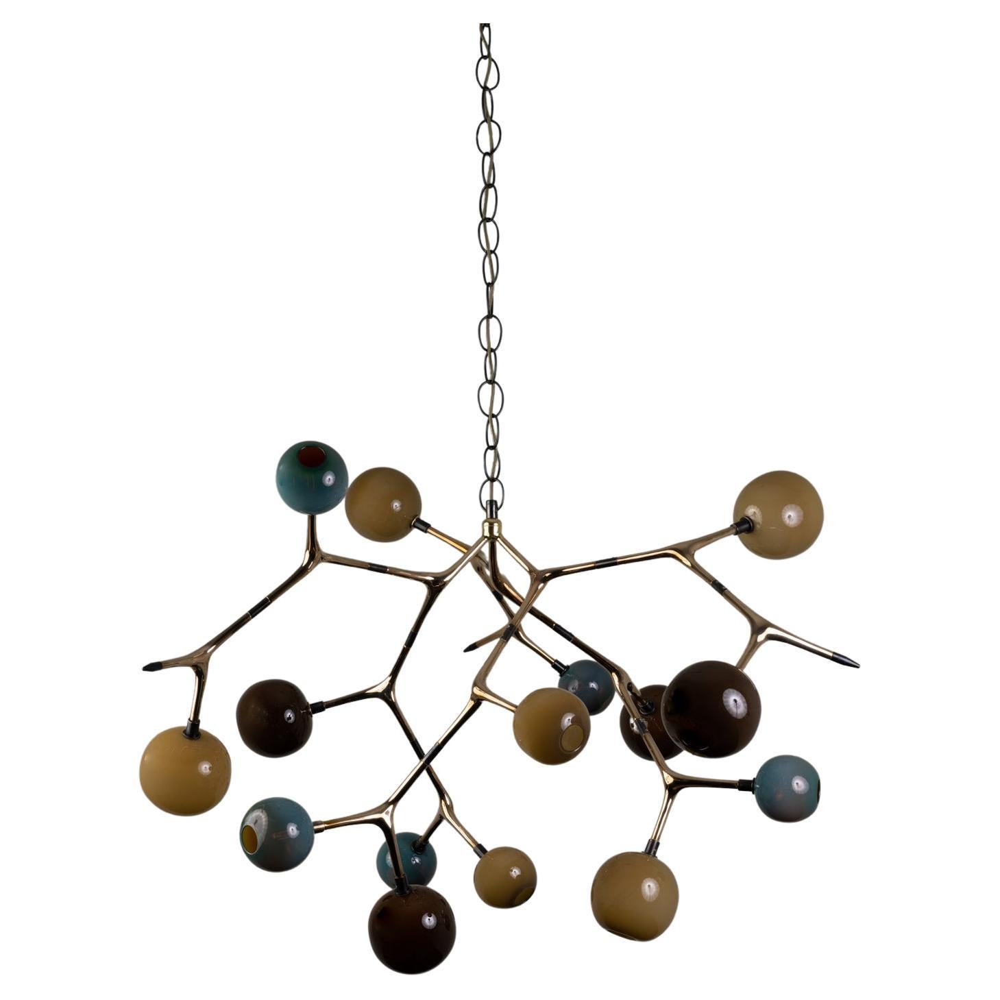 MARATUS 15 chandelier was designed for the Mol collection by Mexican artist Isabel Moncada.

The image of a swarm of small lights at night is mesmerizing. Maratus 15 is a very dramatic piece, ideal for a lobby or double-height space. It uses a