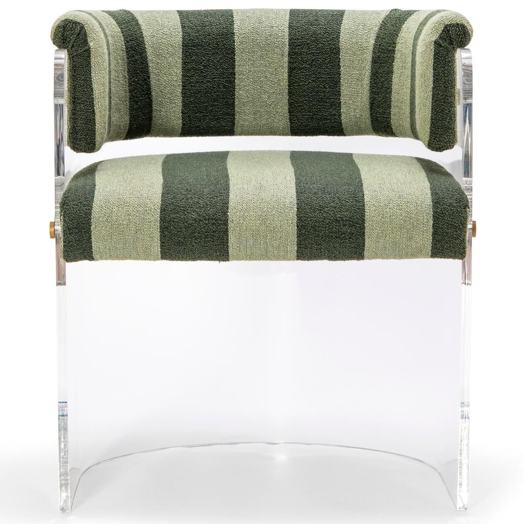 The Anhele dining chair with its 70's futuristic styling has a crystal clear Lucite/Plexiglass/Acrylic shell with a Striped boucle seat and backrest.  The pieces are joined together with polished brass bespoke fixings. These chairs would make a bold