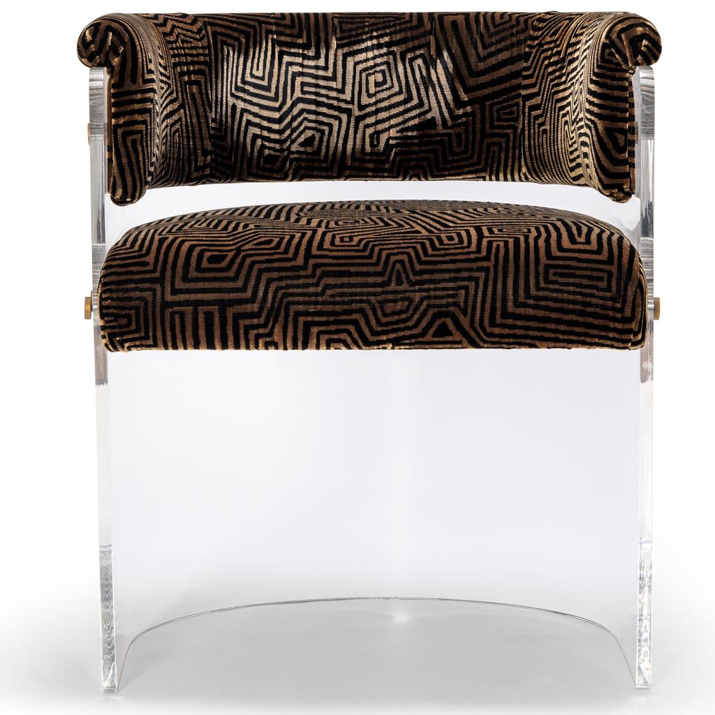 The Anhele dining chair with its 70's futuristic styling has a crystal clear Lucite/Plexiglass/Acrylic shell with a Dedar Jamu Jungle Velvet and backrest.  The pieces are joined together with polished brass bespoke fixings. These chairs would make a