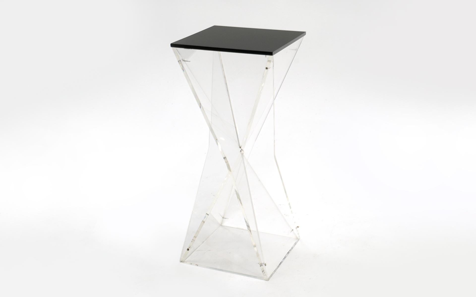 1970s Lucite pedestal / stand / table made of a full one half inch think acrylic. The frame and stand is clear and the removable acrylic top is black. Use is as an art pedestal or tall side table / entry table. Very sturdy geometric faceted