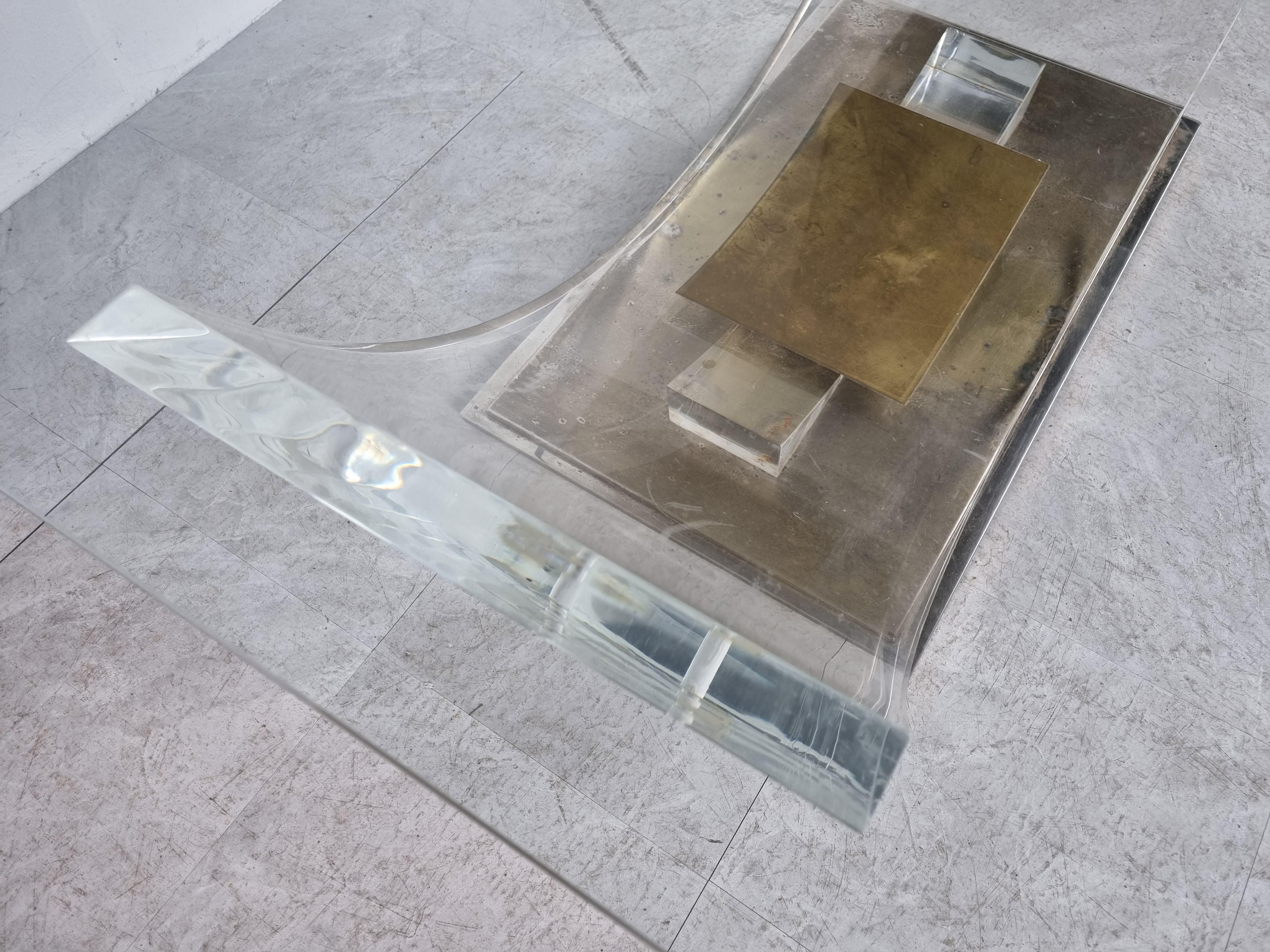 'arch' coffee table with a rectangular glass top in the by Charles Hollis Jonis and made by Belgochrom.

Made from a lucite frame mounted on a heavy brass base.

Patina on the brass.

1970s - Belgium

Dimensions:
Height: 40cm/15.74