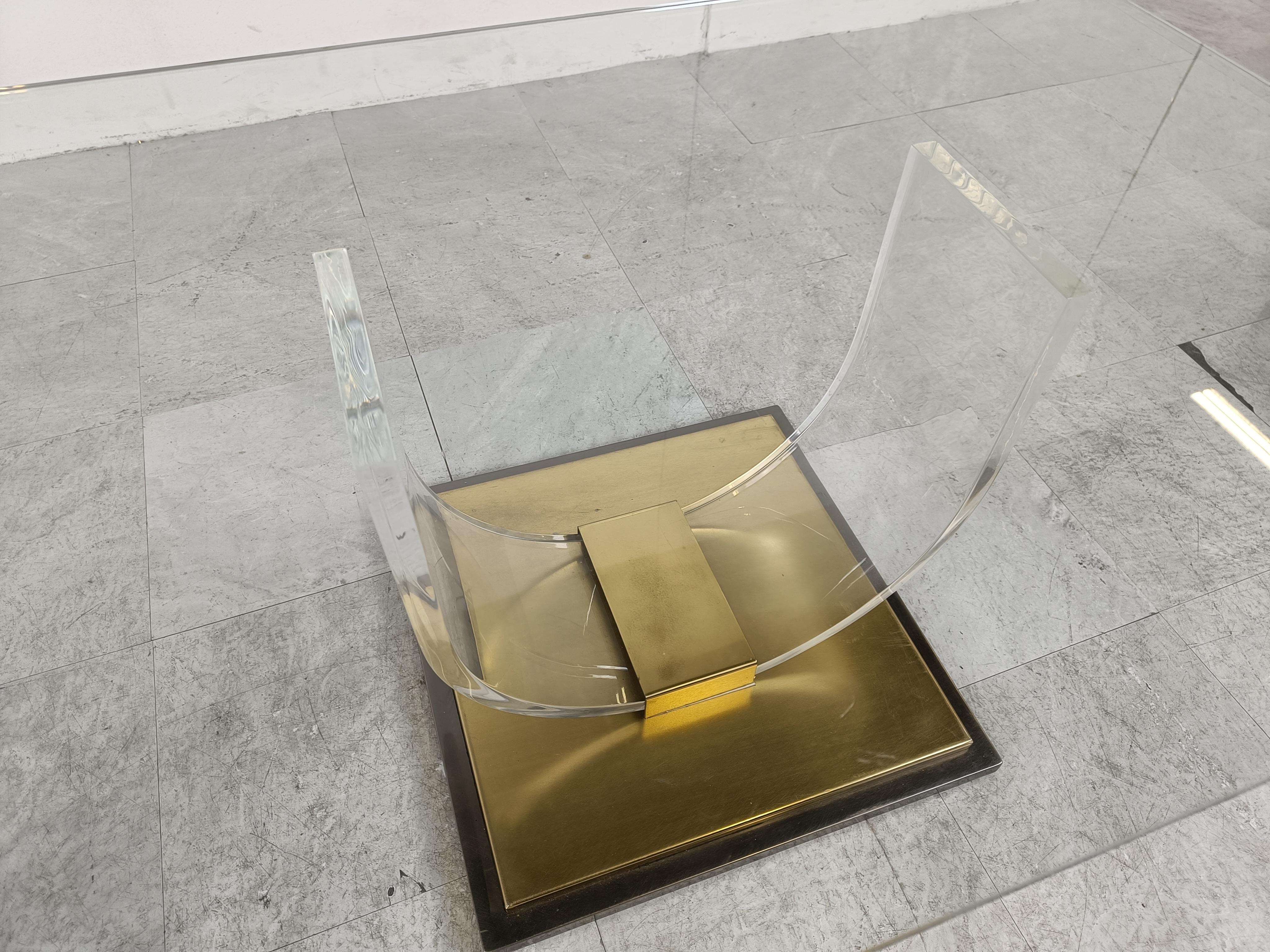 'arch' coffee table with a rectangular glass top by Charles Hollis Jones and made by Belgochrom.

Made from a lucite frame mounted on a heavy brass base.

Patina on the brass.

1970s - Belgium

Dimensions:
Height: 43cm/16.92