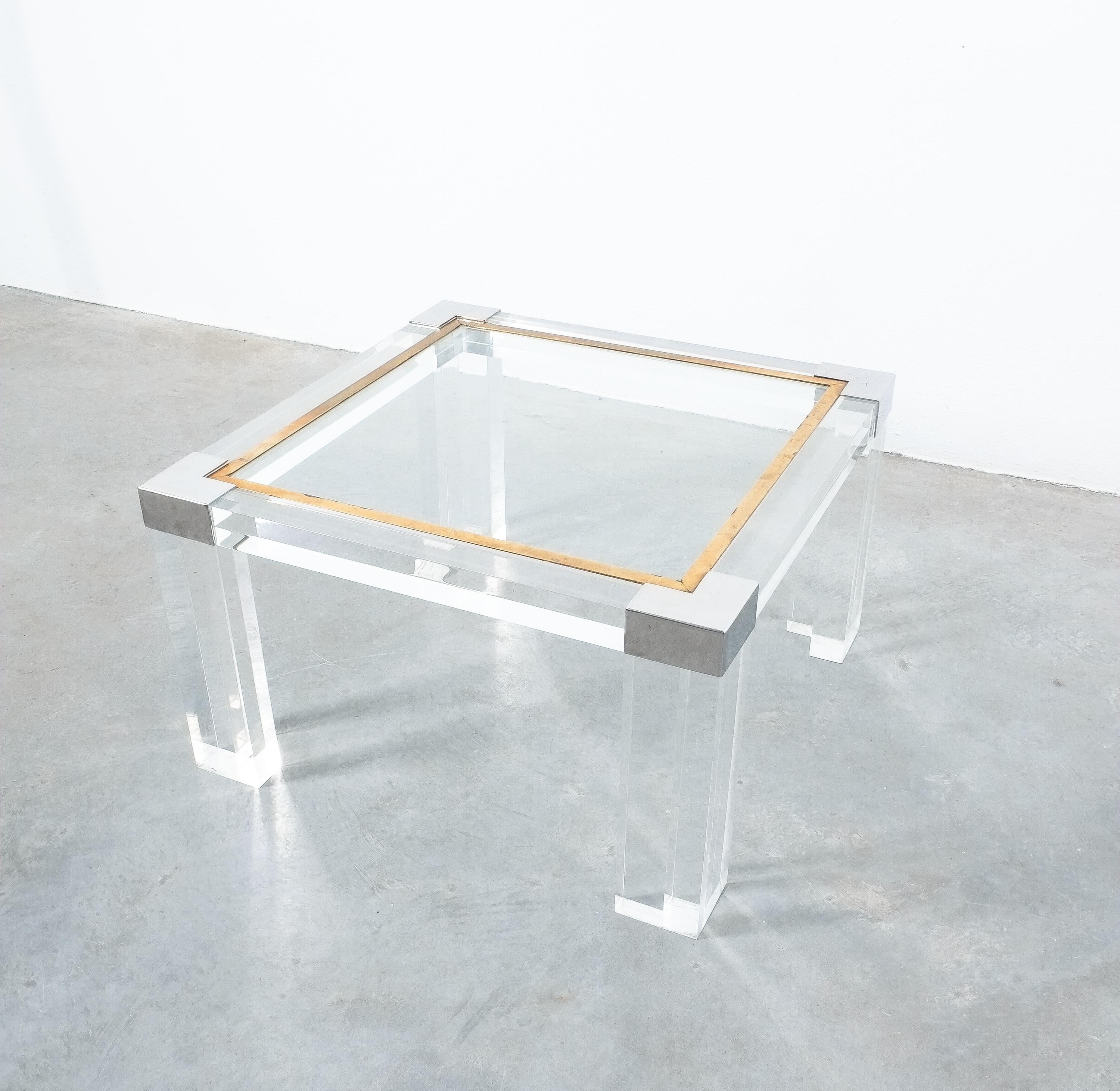Lucite and brass coffee table style Charles Hollis Jones, circa 1970

Nicely sized 28 x 28 inch modernist Lucite coffee or cocktail table with a height of 16.14