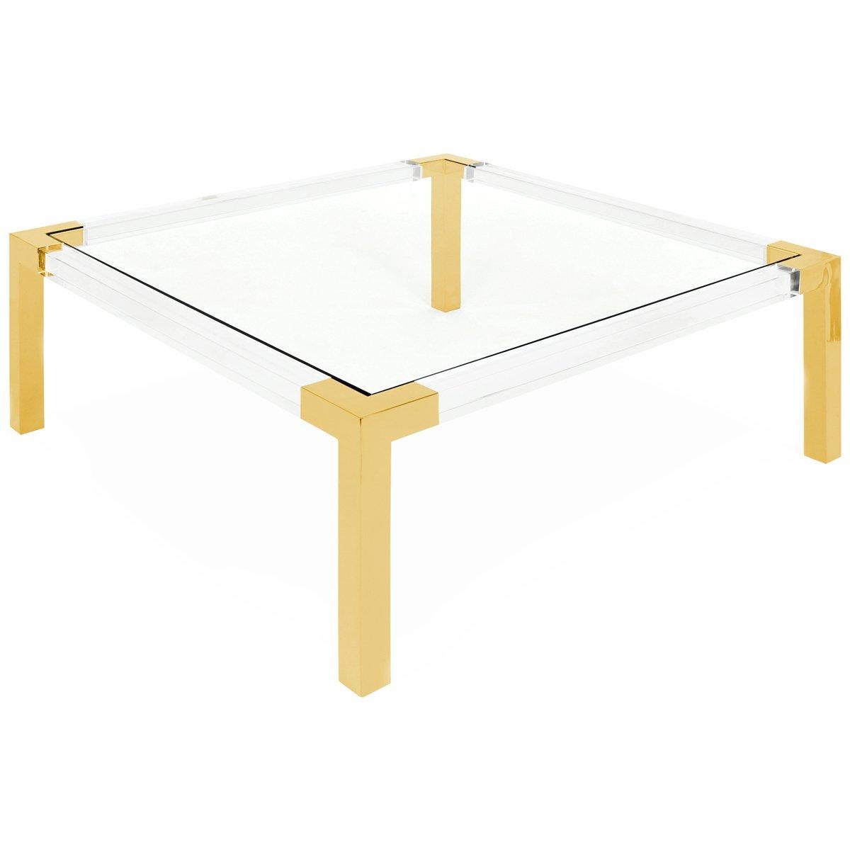 This coffee table is a show stopper! Featuring a Lucite frame with shiny brass detail on legs and a glass inset top. Pairs great with 2-piece sectionals.
Measures: 42