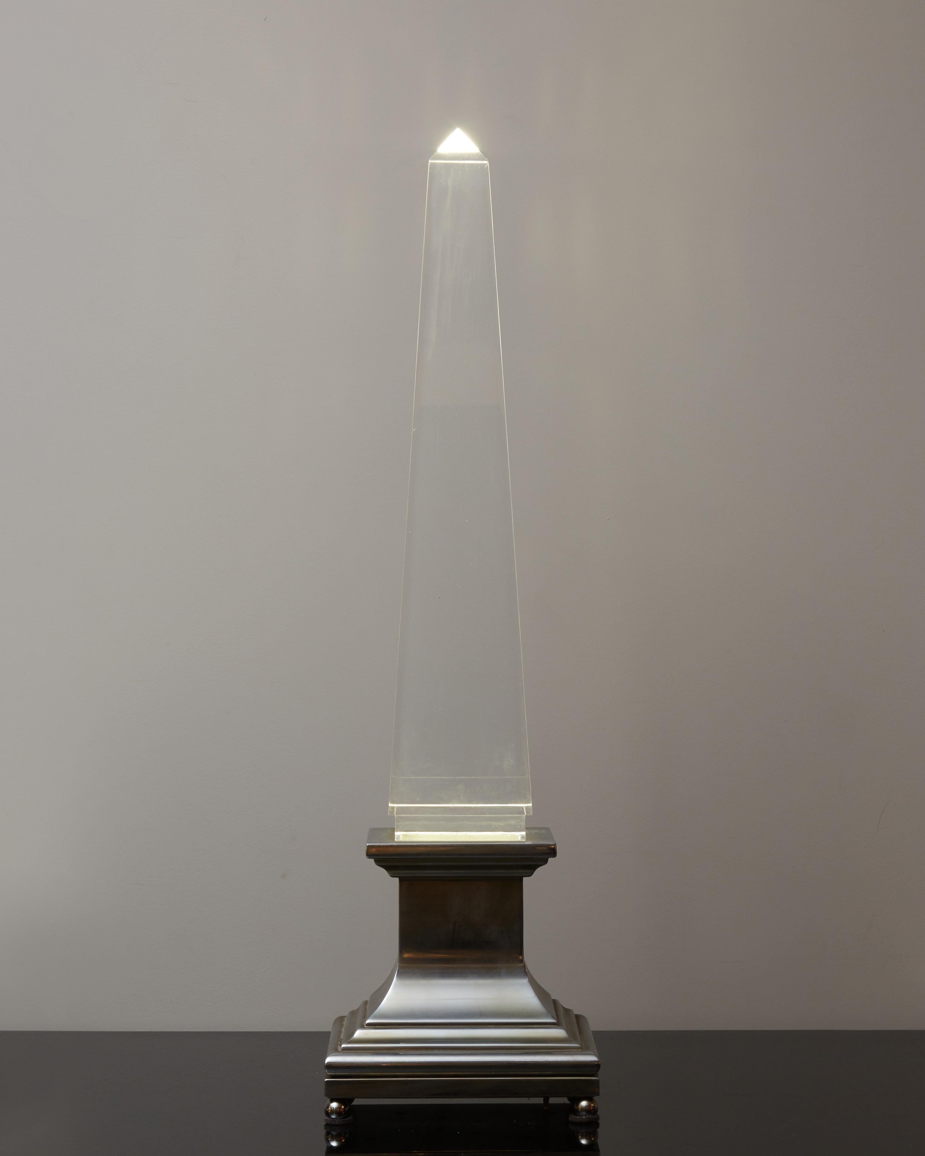 Tall table lamp designed by Sandro Petti for Maison Jansen made of a neo classique brass base in nickel finish and a flawless lucite obelisk.