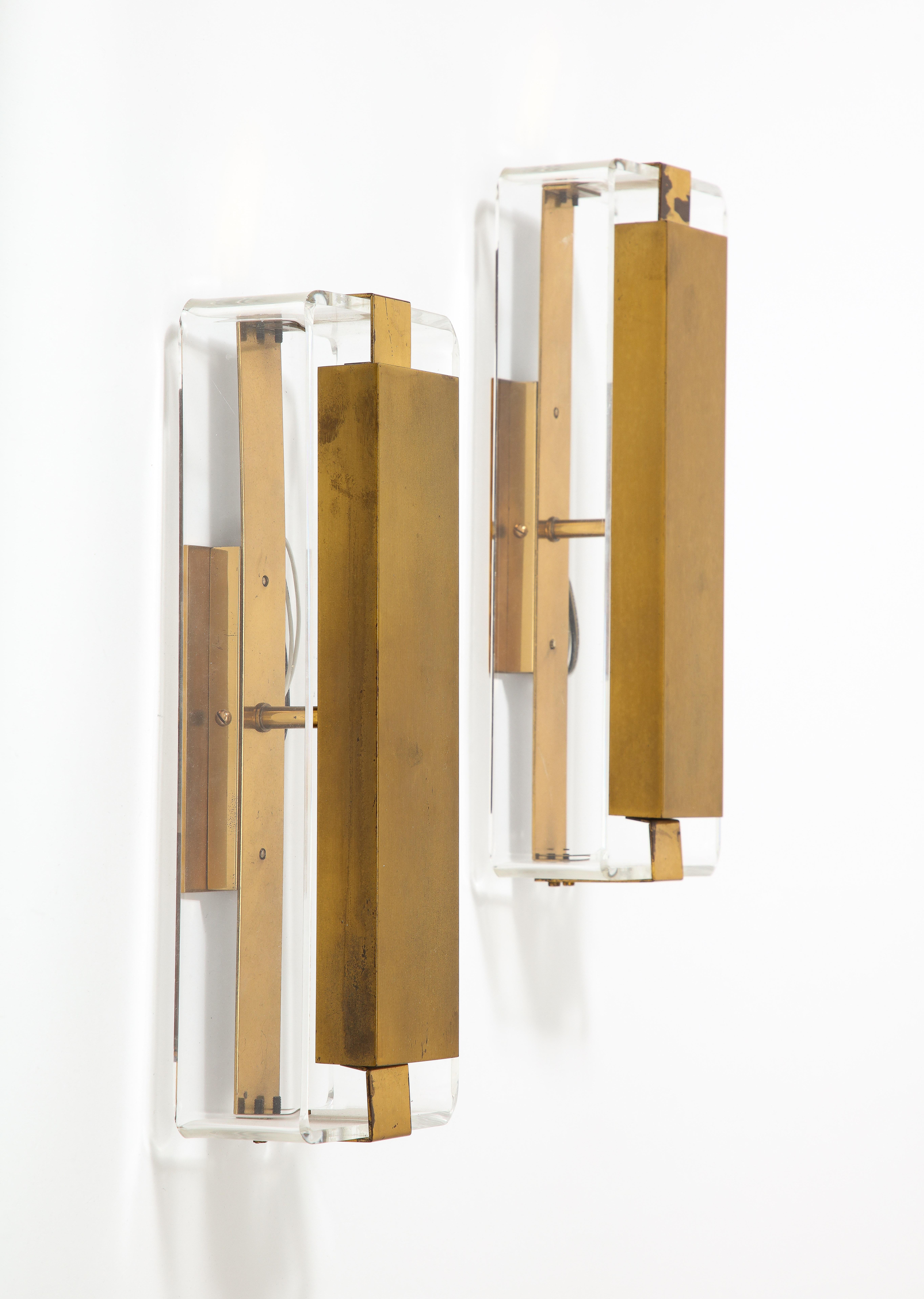 Price is per sconce; two available.

Pair of vintage sconces in lucite and lightly patinaed brass.