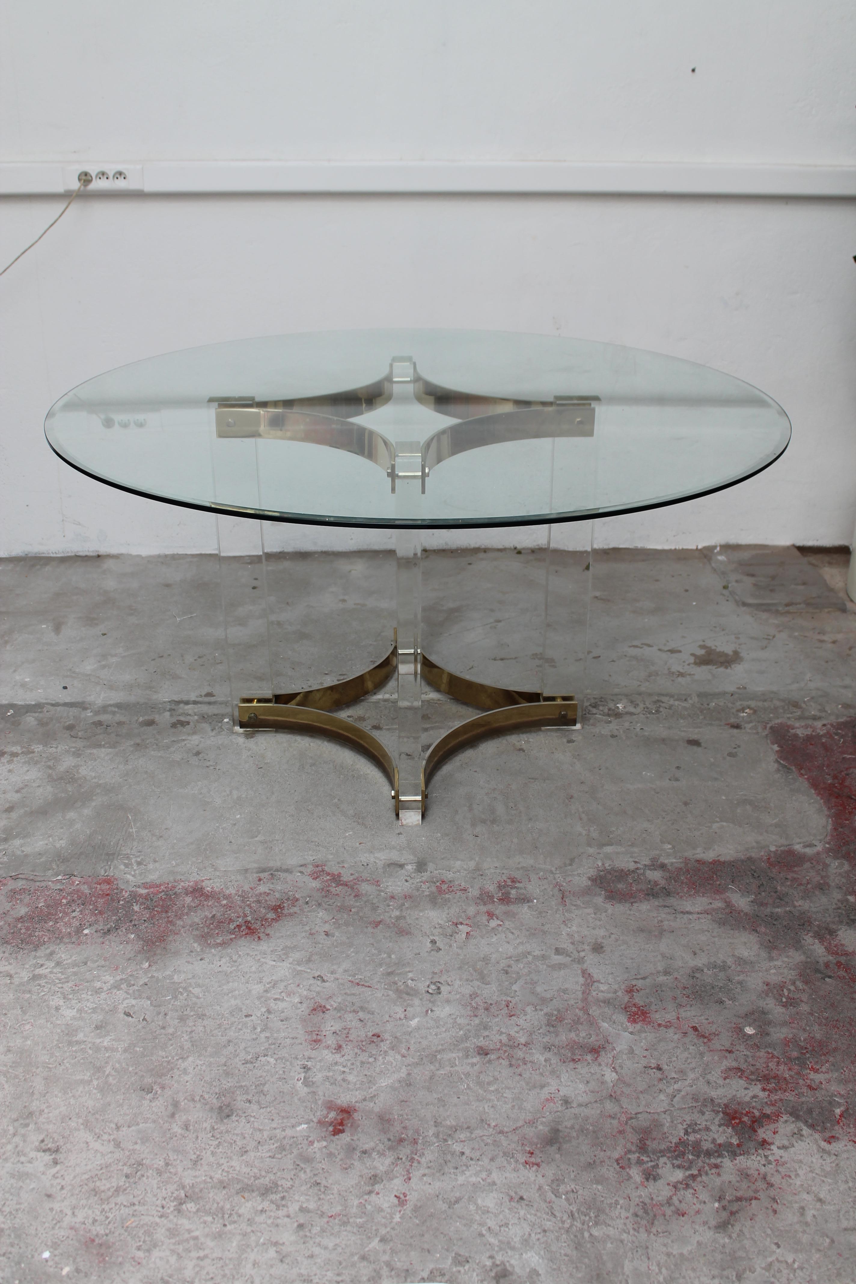 Lucite and brass center or dining table by Romeo Rega

Glass top of and 140 cm diameter and a brass and Lucite base 
Good original conditon with nice patine.