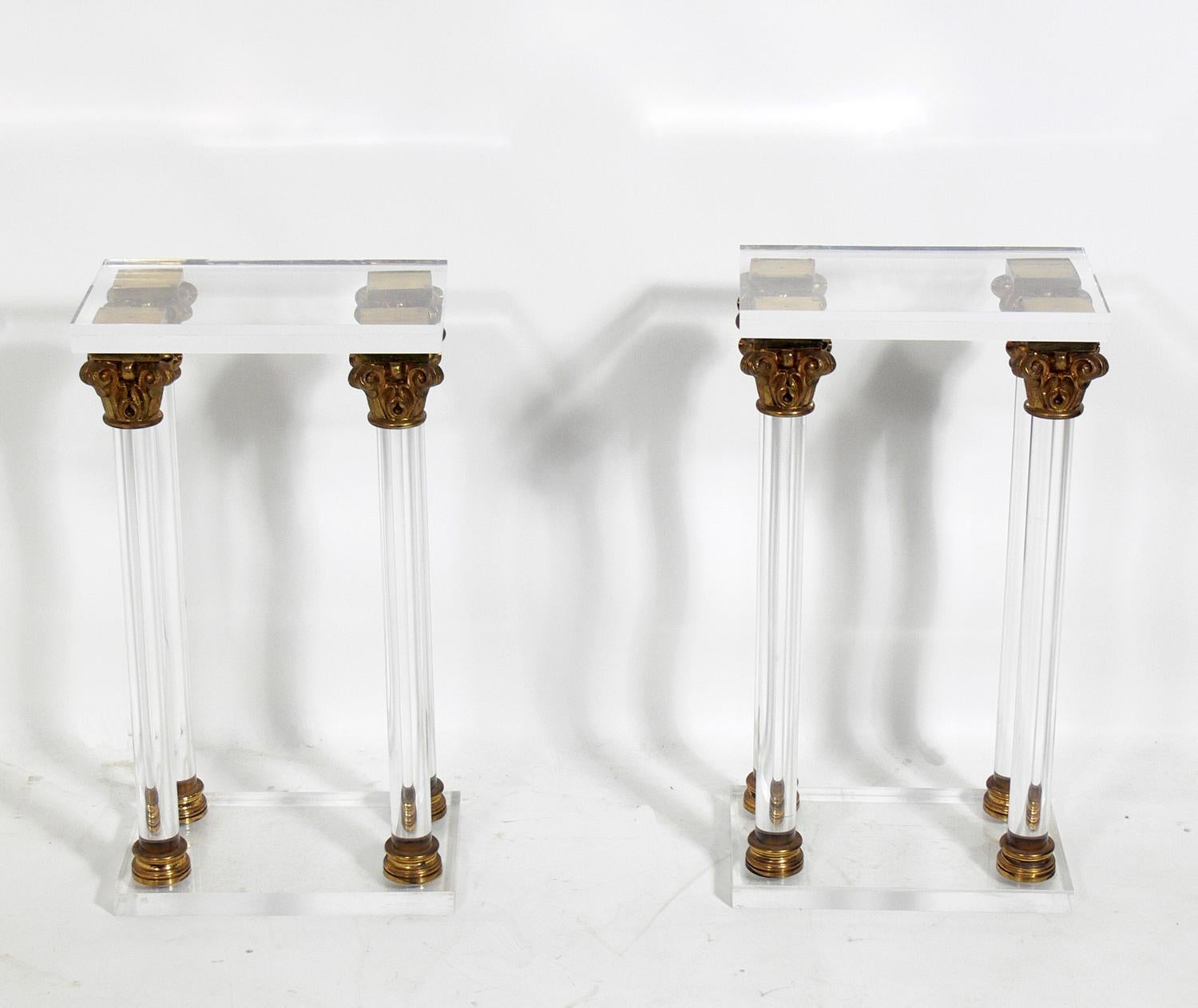 Lucite and bronze column nightstands, probably Italian, circa 1960s. They are a versatile size and can be used as nightstands or pedestals.