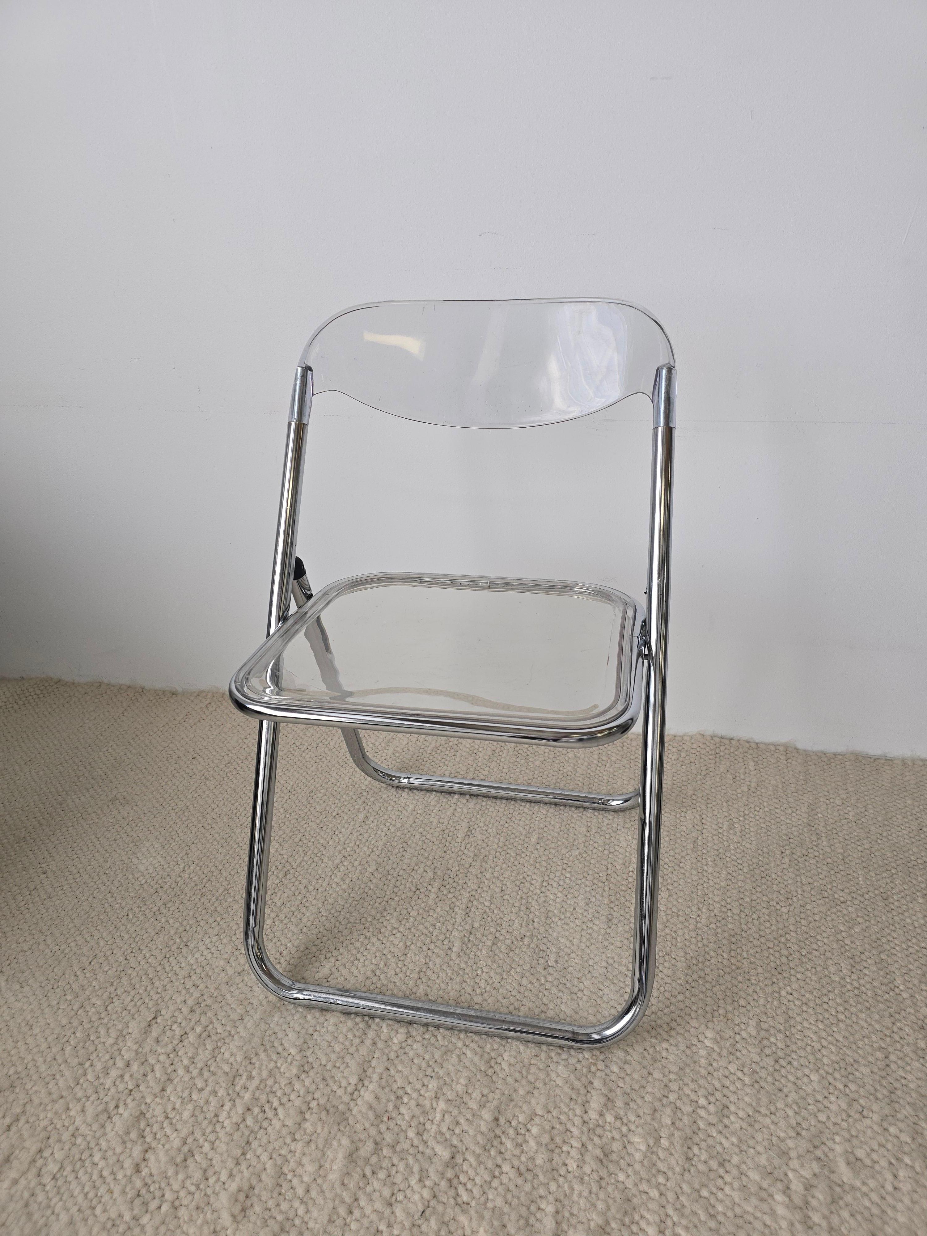 Lucite and chrome folding chair is attributed to Brevettato. The body is made in chrome with lucite backrest and seat. The lucite seat is removable. It's made in the 1970s in Italy. The perfect chair for small spaces and easy to store. In overall