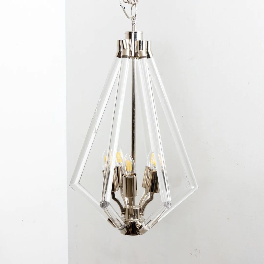 Lucite and chrome chandelier. Five sockets. Chandelier without chain is 24