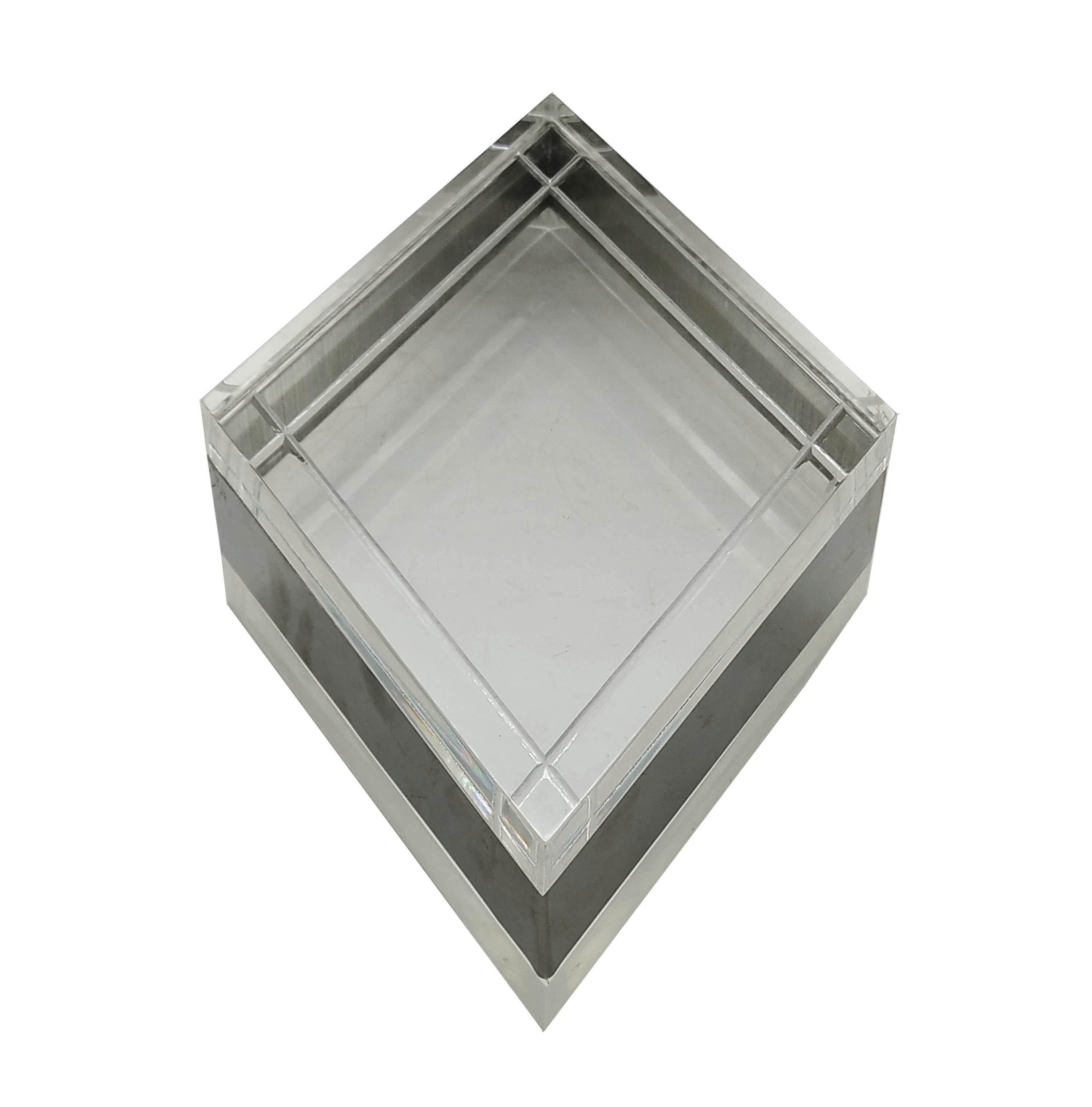 Decorative rhombus-shaped box in lucite and silver. This object was designed in the 1970s. Inspired by Gabriella Crespi.
   