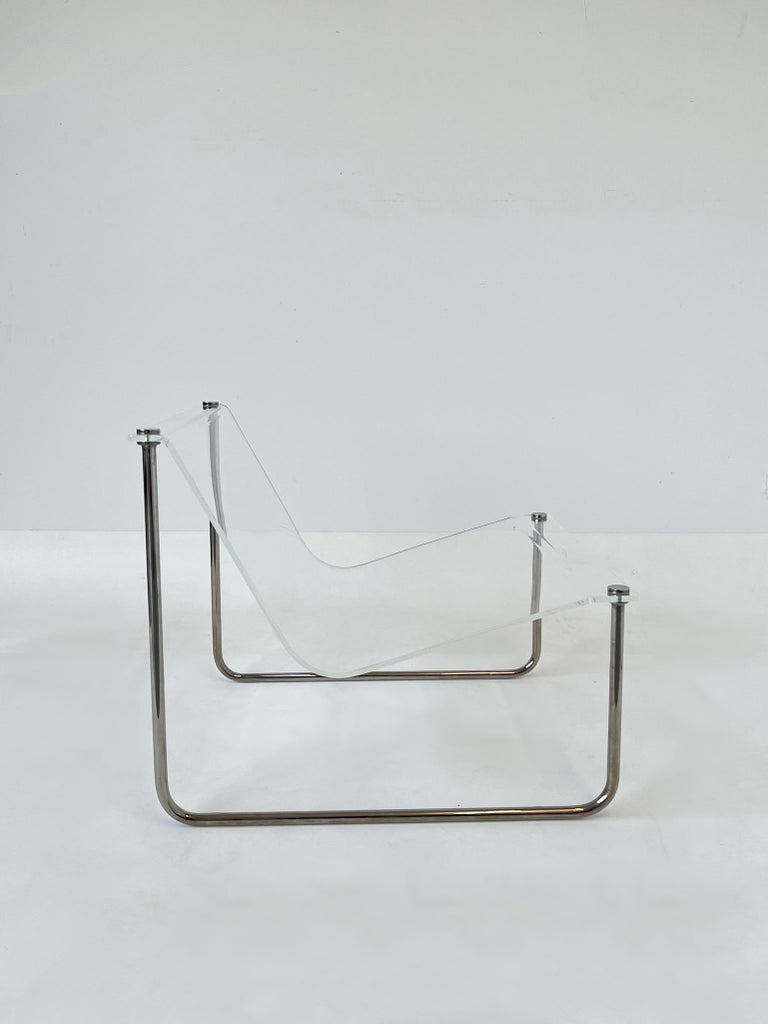 Iconic lucite sling chair from the 1970’s by Charles Hollis Jones. 
Constructed of chrome plated steel and clear acrylic.
In beautiful vintage condition. 
Measurements: 24.75” Wide 29” Deep, 23.25” High, 14” Seat.