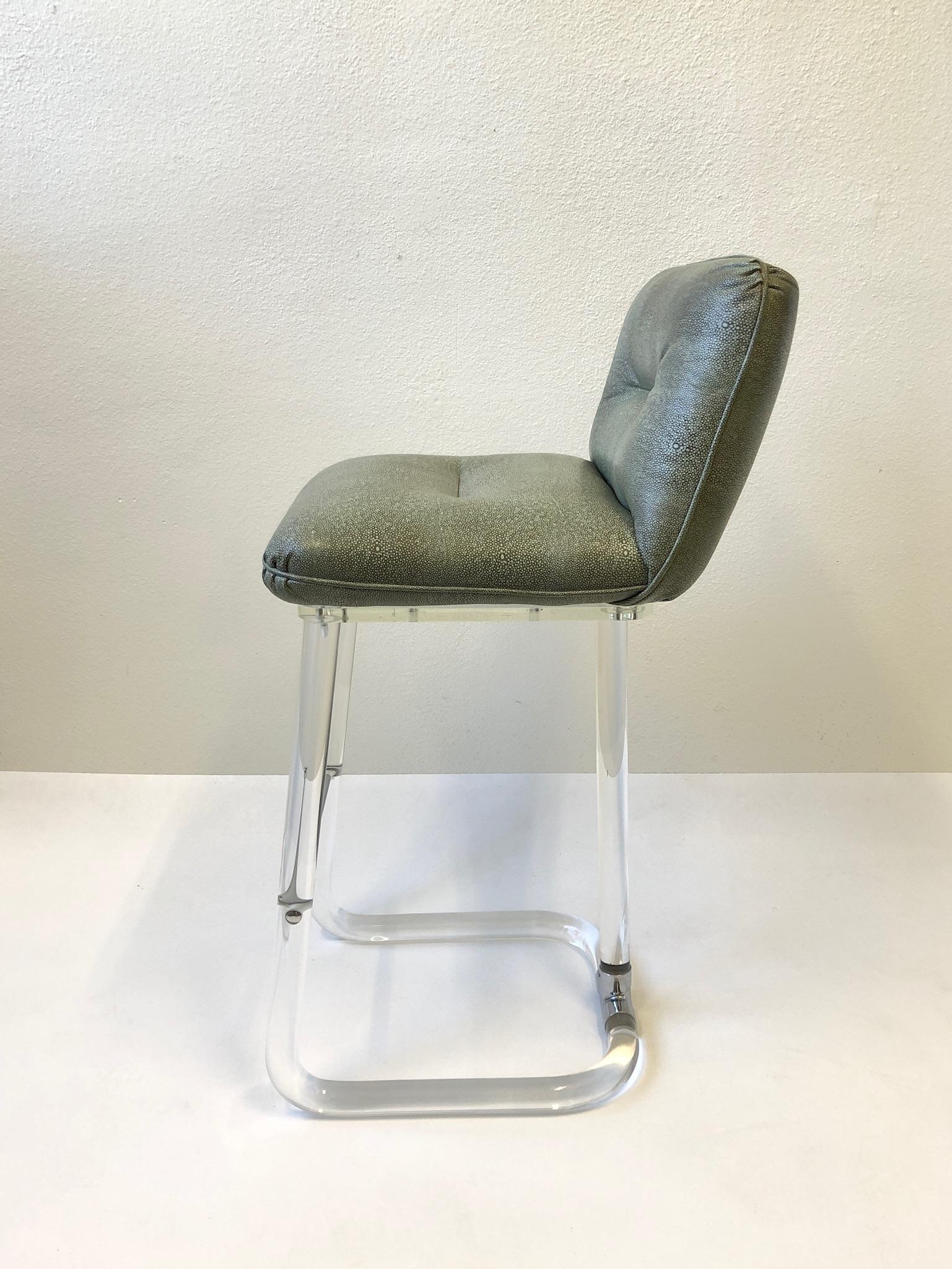 A beautiful clear Lucite and polish chrome with embossed shagreen leather seat barstool. Design by Lion in Frost in the 1980s. The stool is sign( see detail photos).
Measurements: 39.5” high 19” wide 22.5” deep 30.5” seat.
