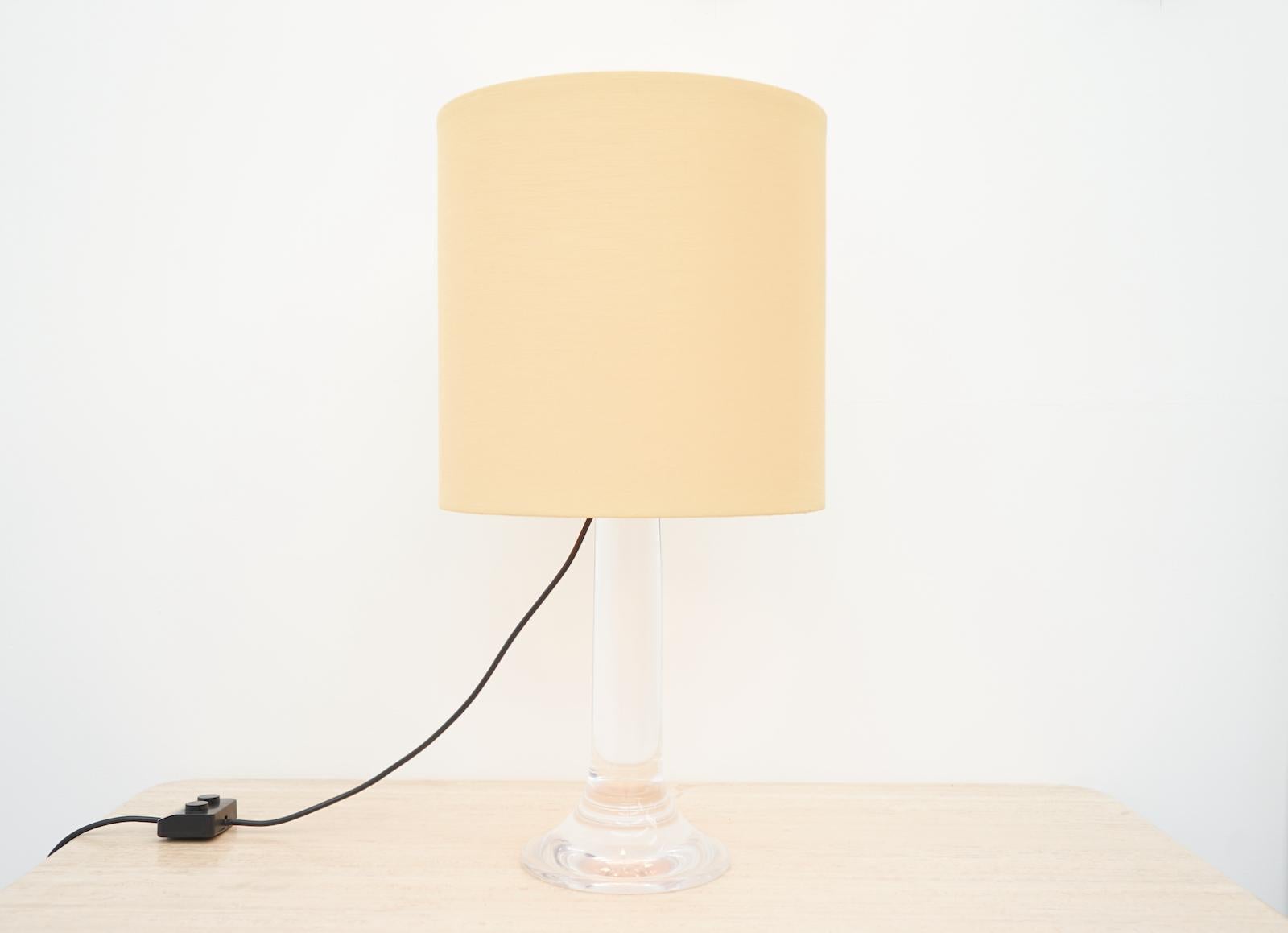 Large Table or Floor Lamp with a solid lucite base and a original fabric shade.
Good to very good condition.