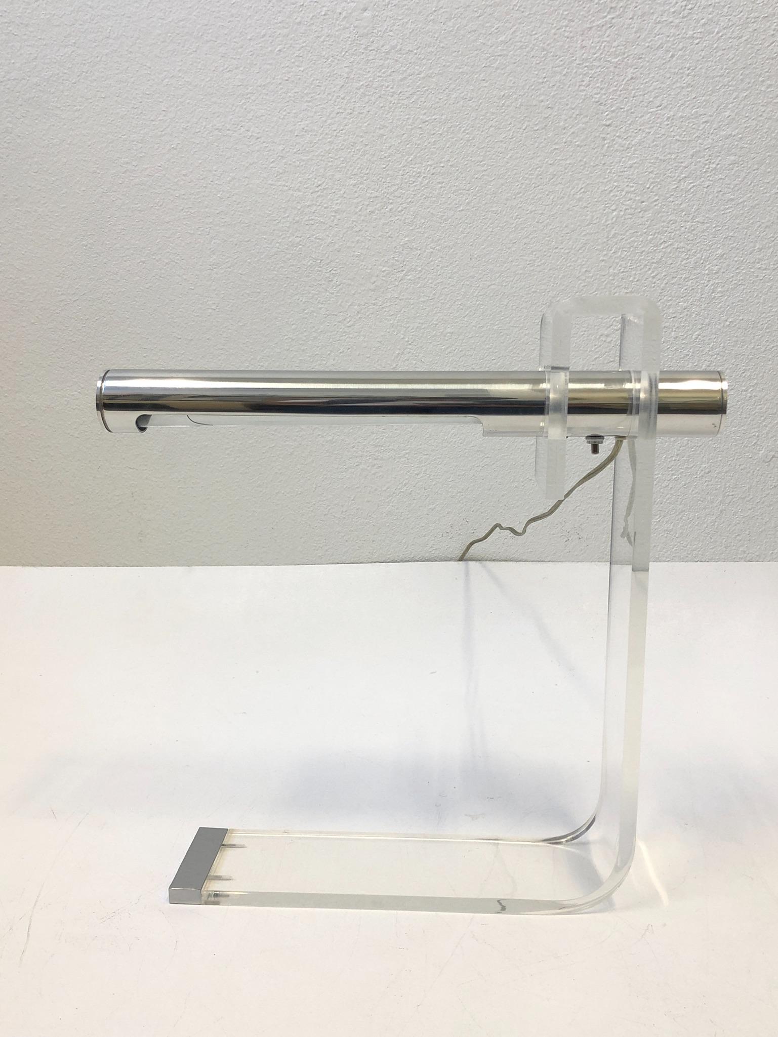 1970s clear Lucite and polish aluminum table lamp or desk lamp design by Robert Sonneman. The lamp has been newly rewired and professionally polished.
Measurements: 18” wide, 4” deep and 18” high.