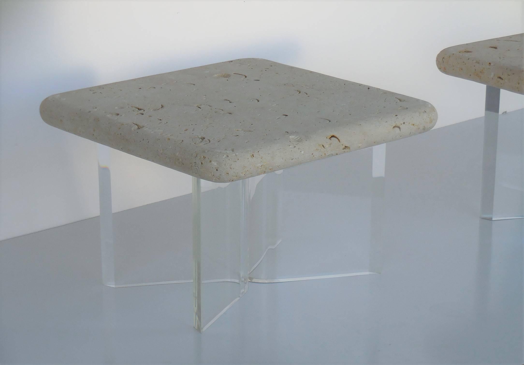 A pair of Lucite and fossil stone side tables from the 1970s. Thick planks of solid fossil stone rest on robust Lucite bases. The fossil stone tops are 2.5
