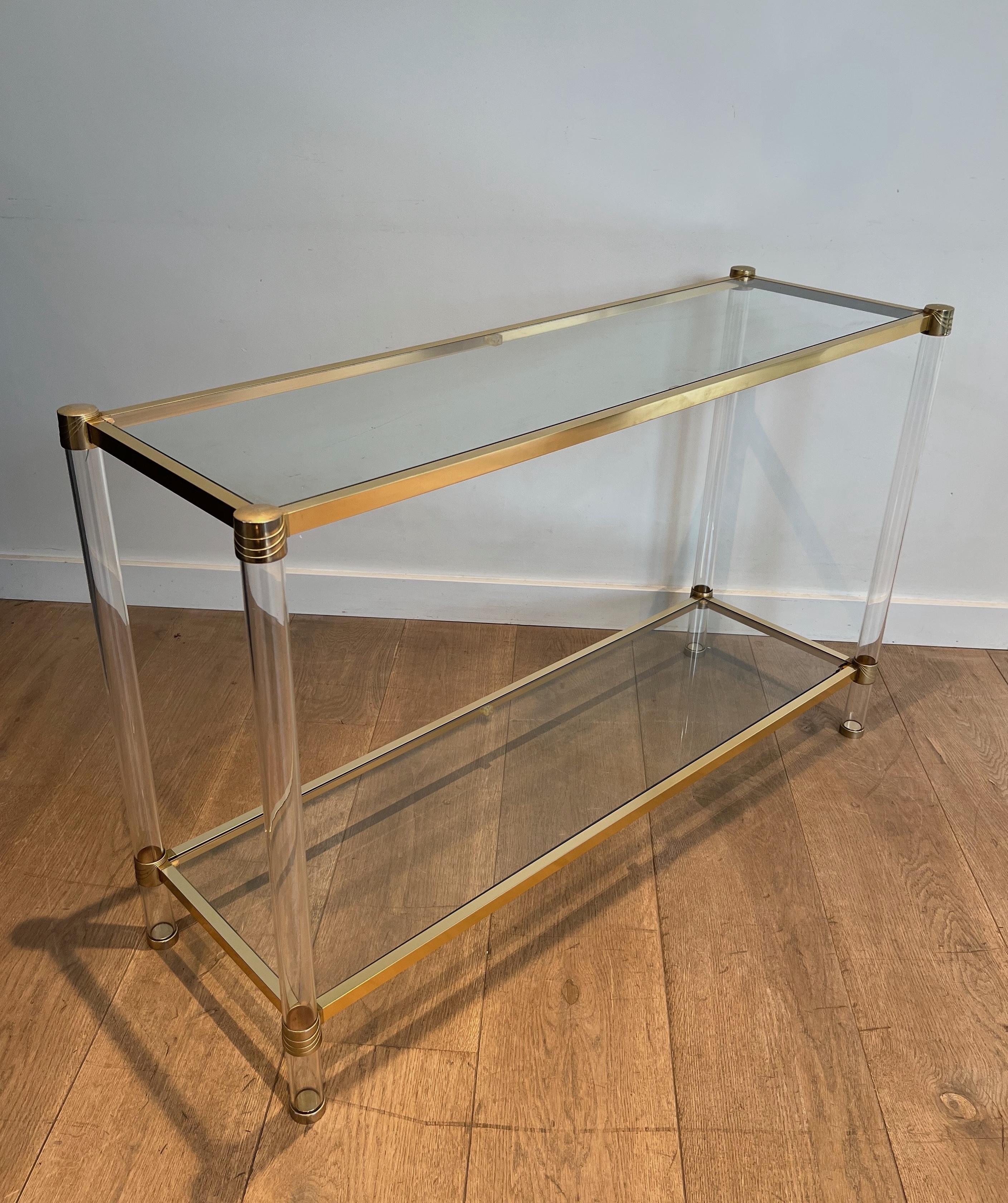 This very nice and elegant console table is made of lucite legs and gilt metal. This is a French work. Circa 1970