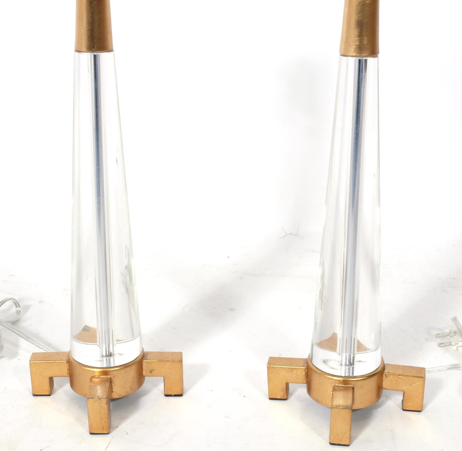 Lucite or Acrylic and Gilt Metal Lamps, American, circa 2000s. The price noted includes the shades.